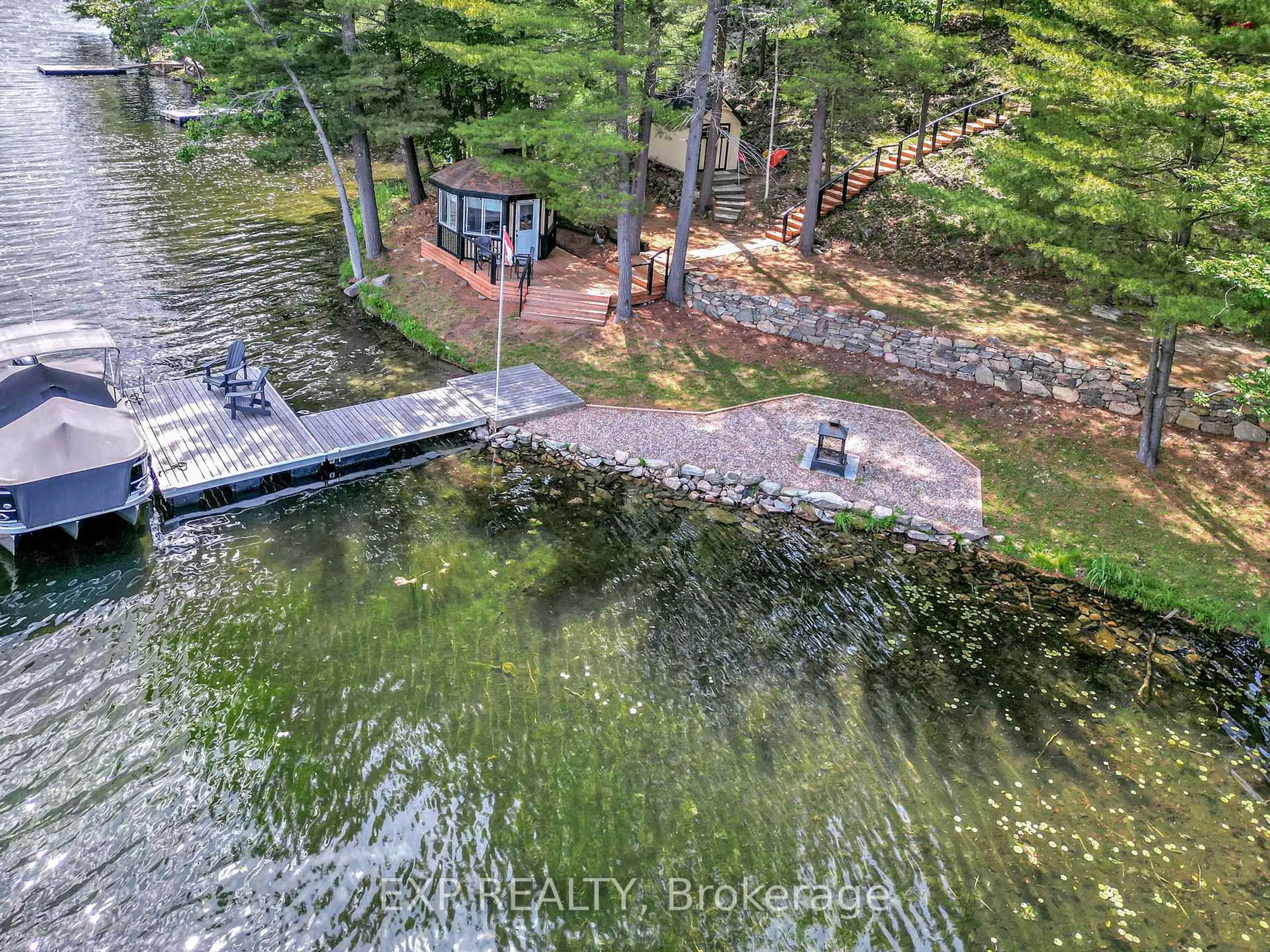 A pic from outside/outdoor area/front of a property/back of a property/a pic from drone, water/lake/river/ocean view for 159 Sleepy Haven Lane, Perth Road Ontario K0H 2L0
