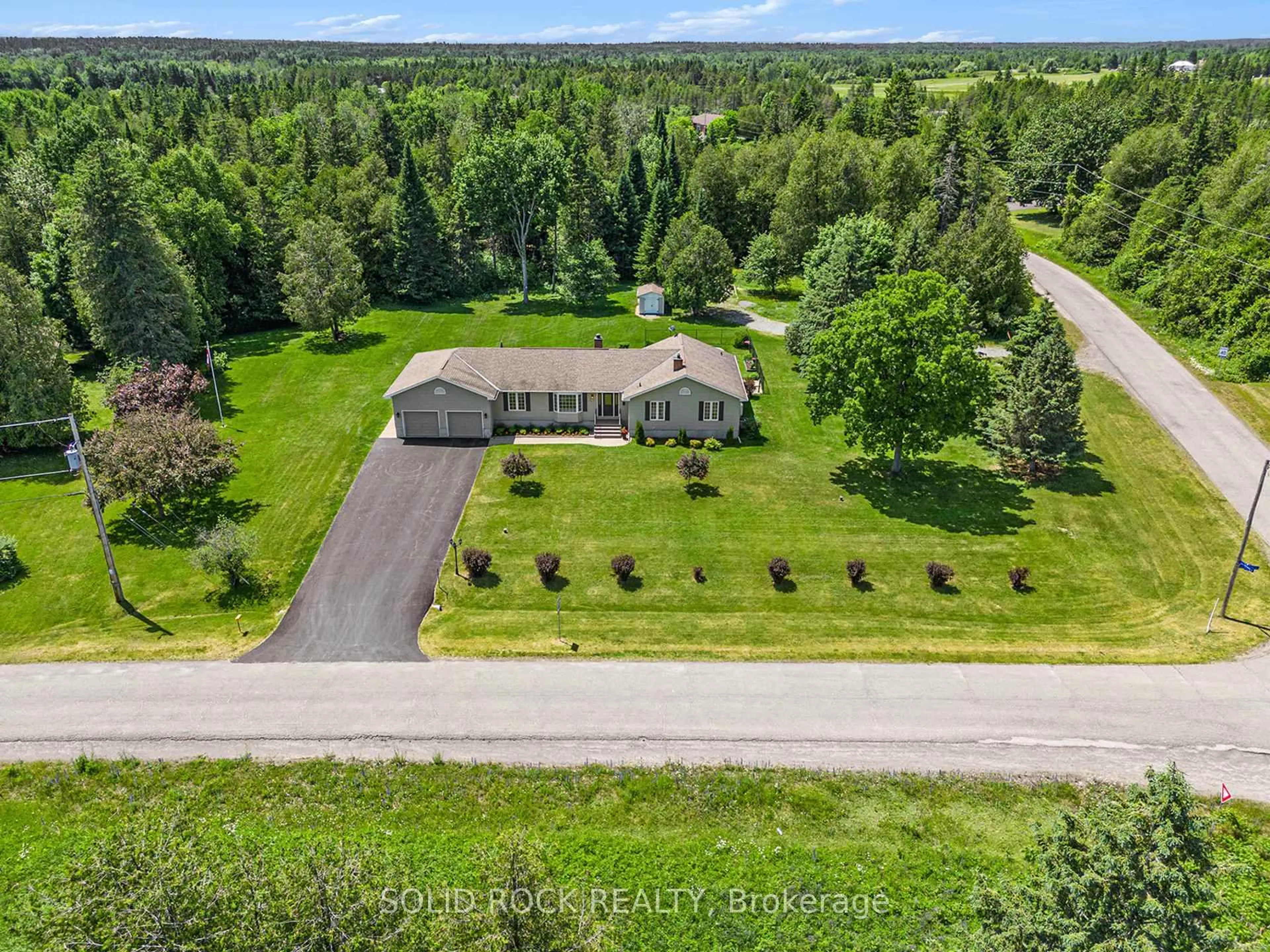 A pic from outside/outdoor area/front of a property/back of a property/a pic from drone, unknown for 135 Delaney Dr, Carp Ontario K0A 1L0