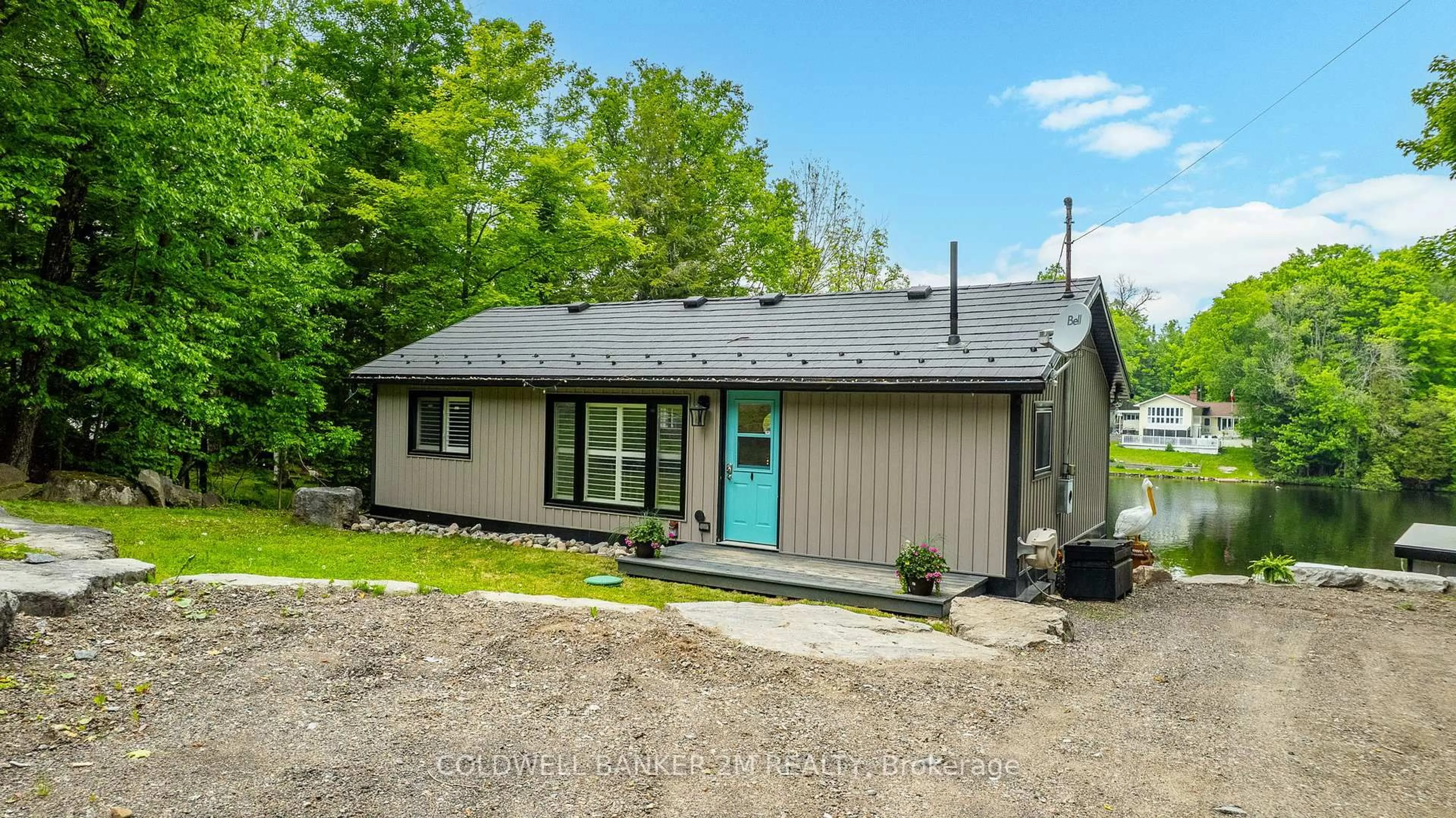 Home with vinyl exterior material, street for 1174 Birch Narrows Rd, Dysart et al Ontario K0M 1S0