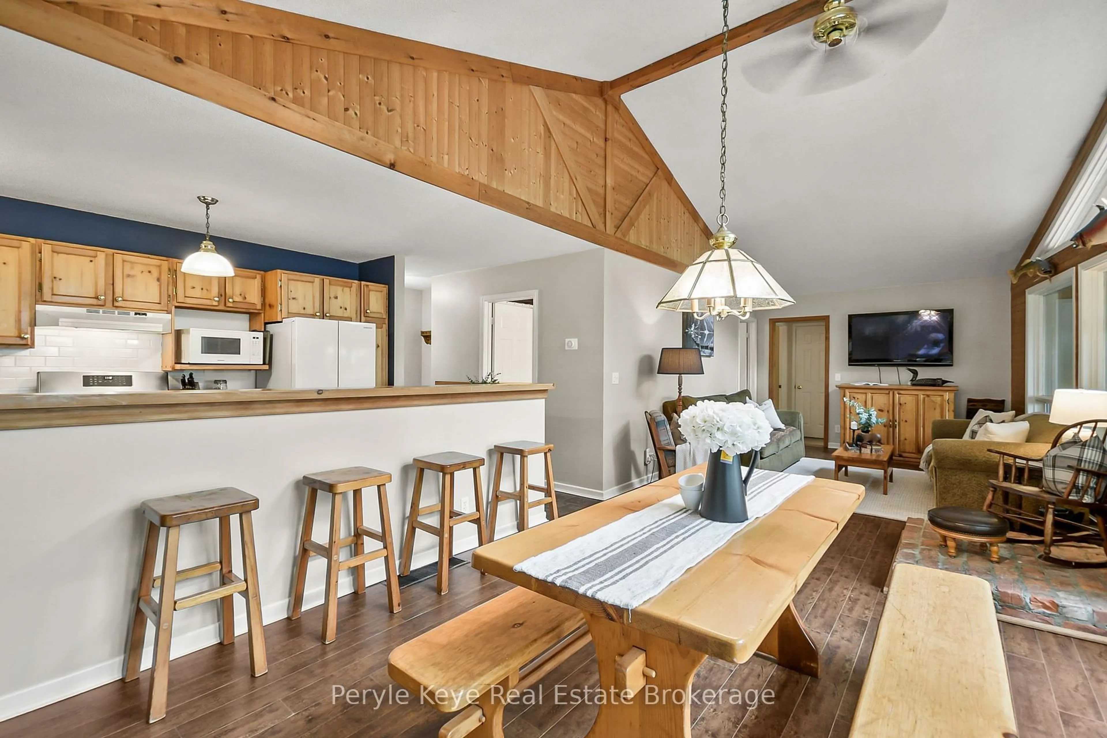 Open concept kitchen, wood/laminate floor for 1258 Windermere Rd #4, Muskoka Lakes Ontario P0B 1M0