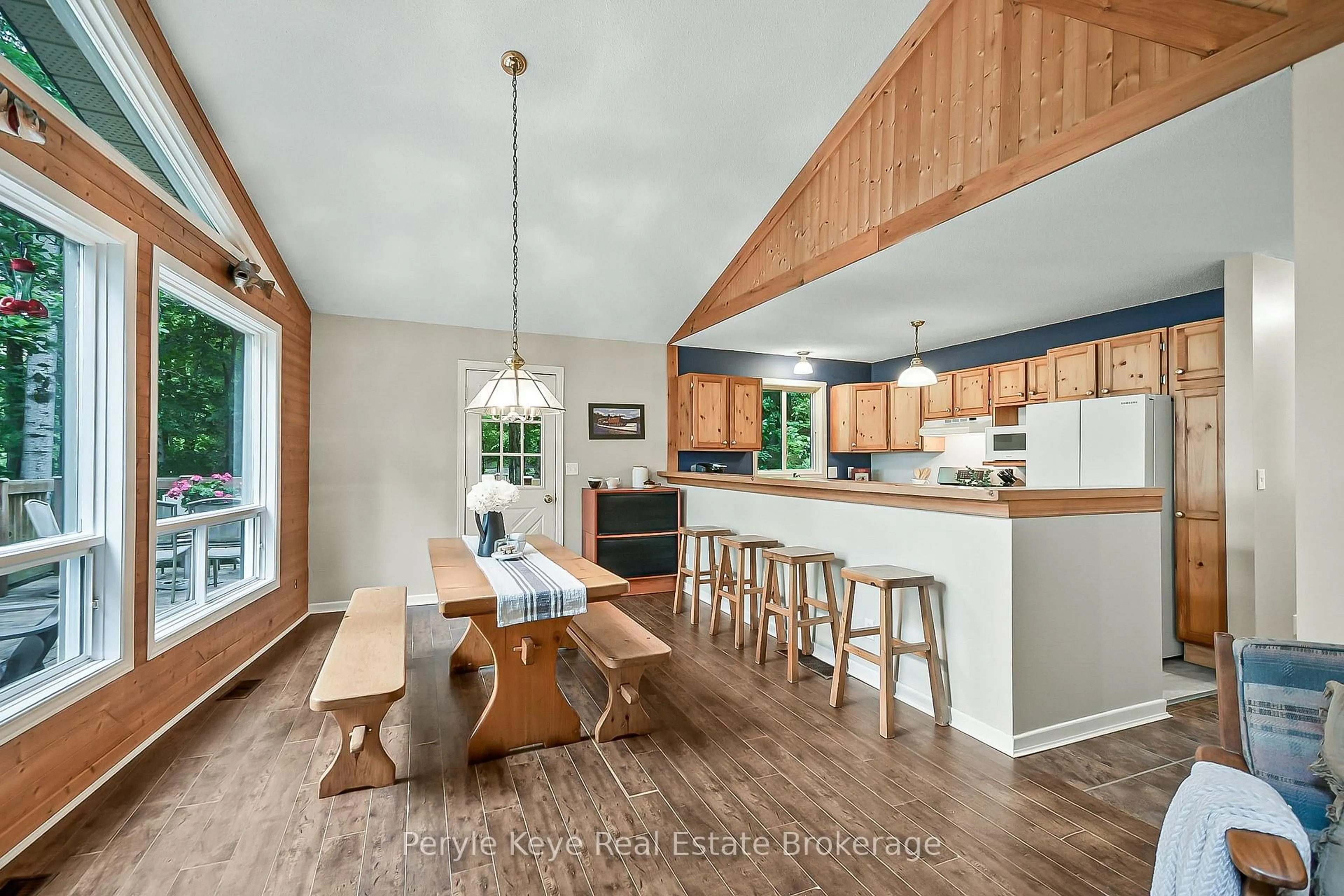 Open concept kitchen, wood/laminate floor for 1258 Windermere Rd #4, Muskoka Lakes Ontario P0B 1M0
