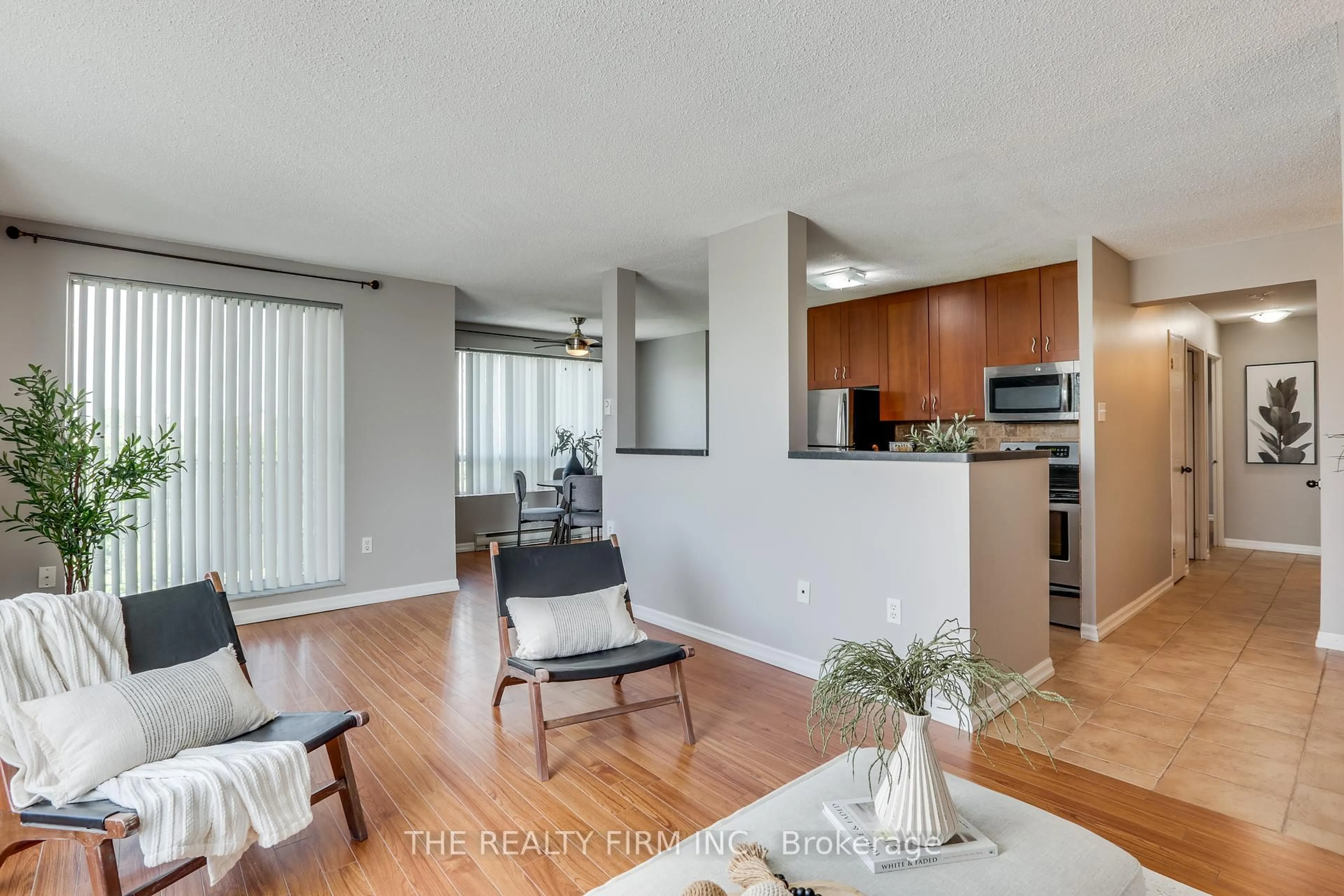 Open concept kitchen, wood/laminate floor for 333 Commissioners Rd #507, London South Ontario N6J 4X7