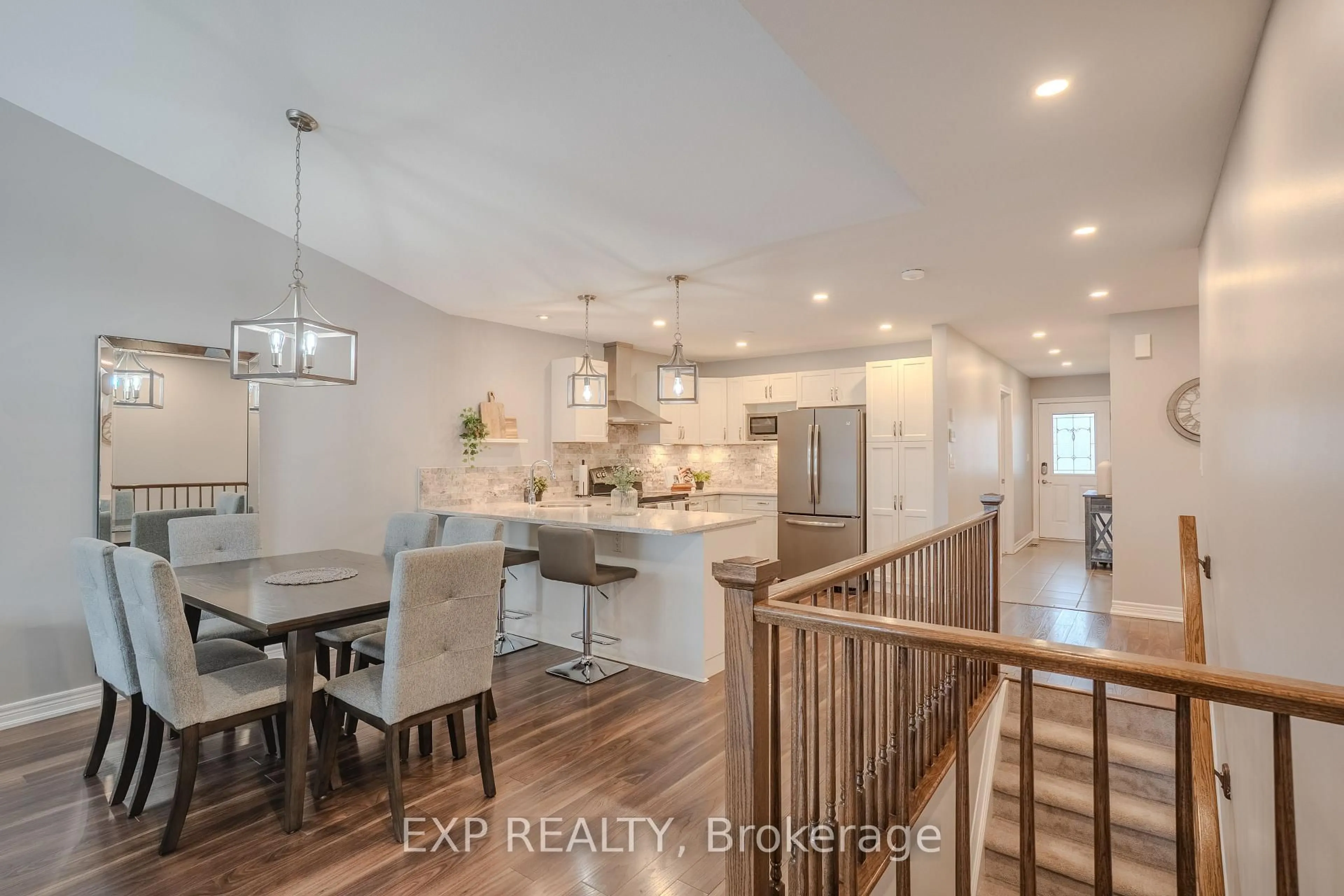 Open concept kitchen, wood/laminate floor for 8719 Upper Canada Dr, Niagara Falls Ontario L2H 0B8