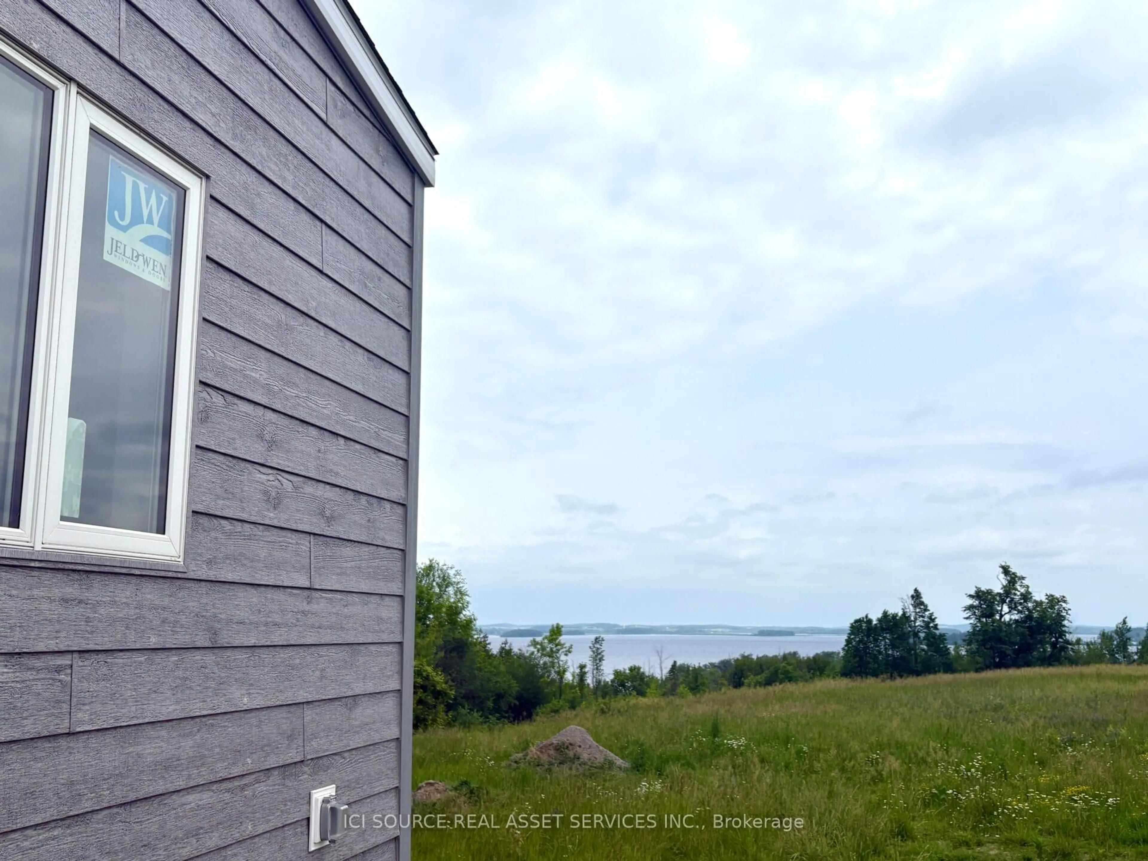 A pic from outside/outdoor area/front of a property/back of a property/a pic from drone, water/lake/river/ocean view for 7100 County Rd #BGR707, Alnwick/Haldimand Ontario K0K 2X0