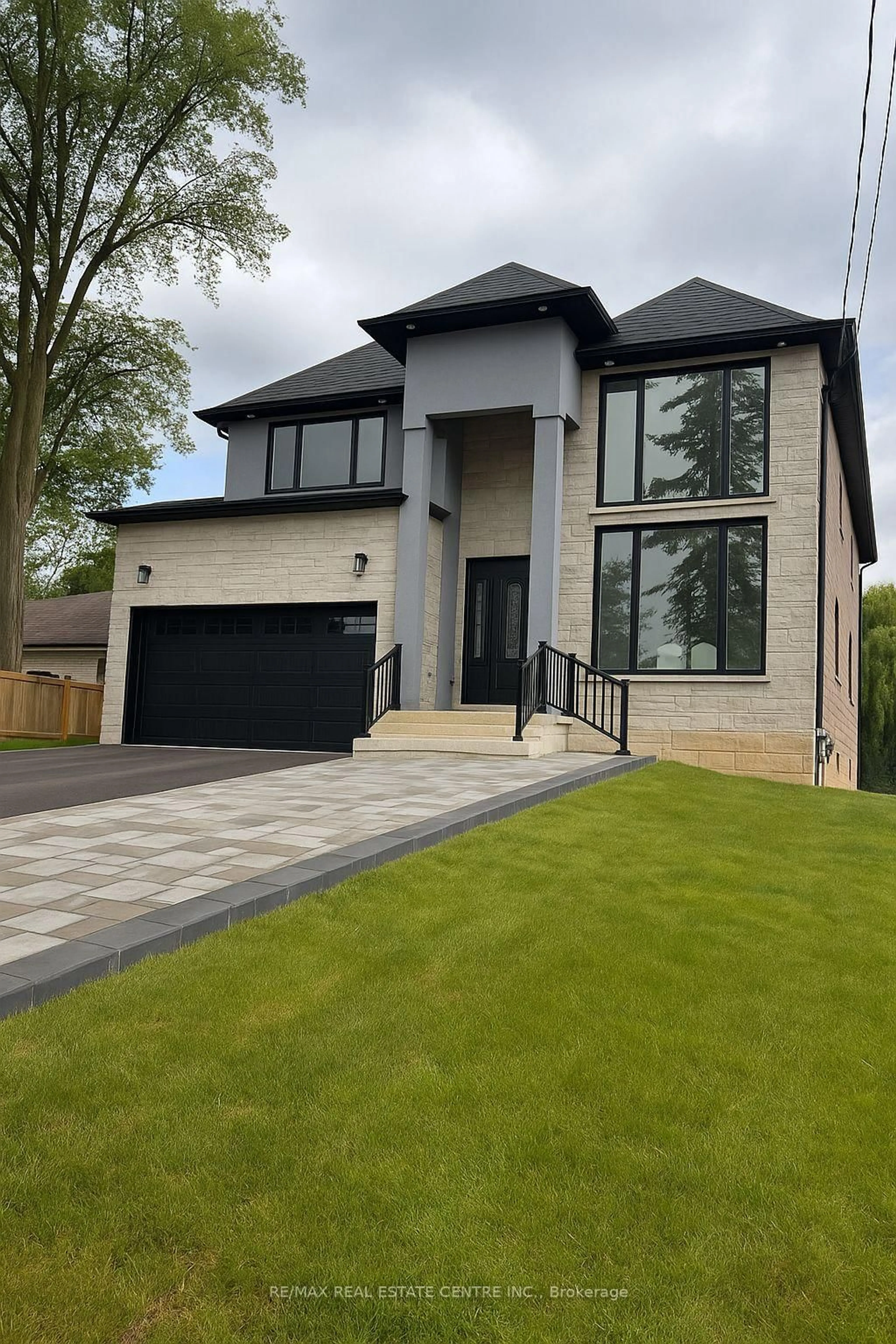 Home with brick exterior material, street for 653 Mohawk Rd, Hamilton Ontario L9G 2X1