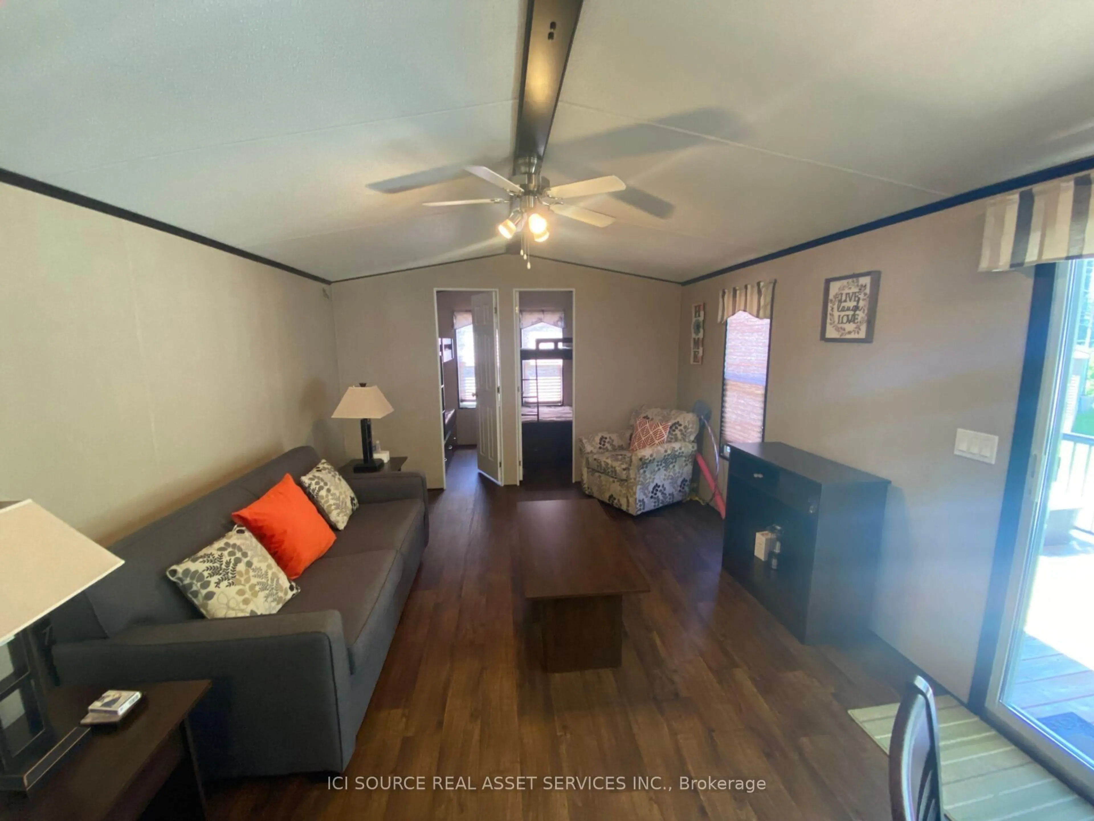 Living room with furniture, wood/laminate floor for 1082 Shamrock Marina Rd #SMR251, Gravenhurst Ontario P0E 1N0