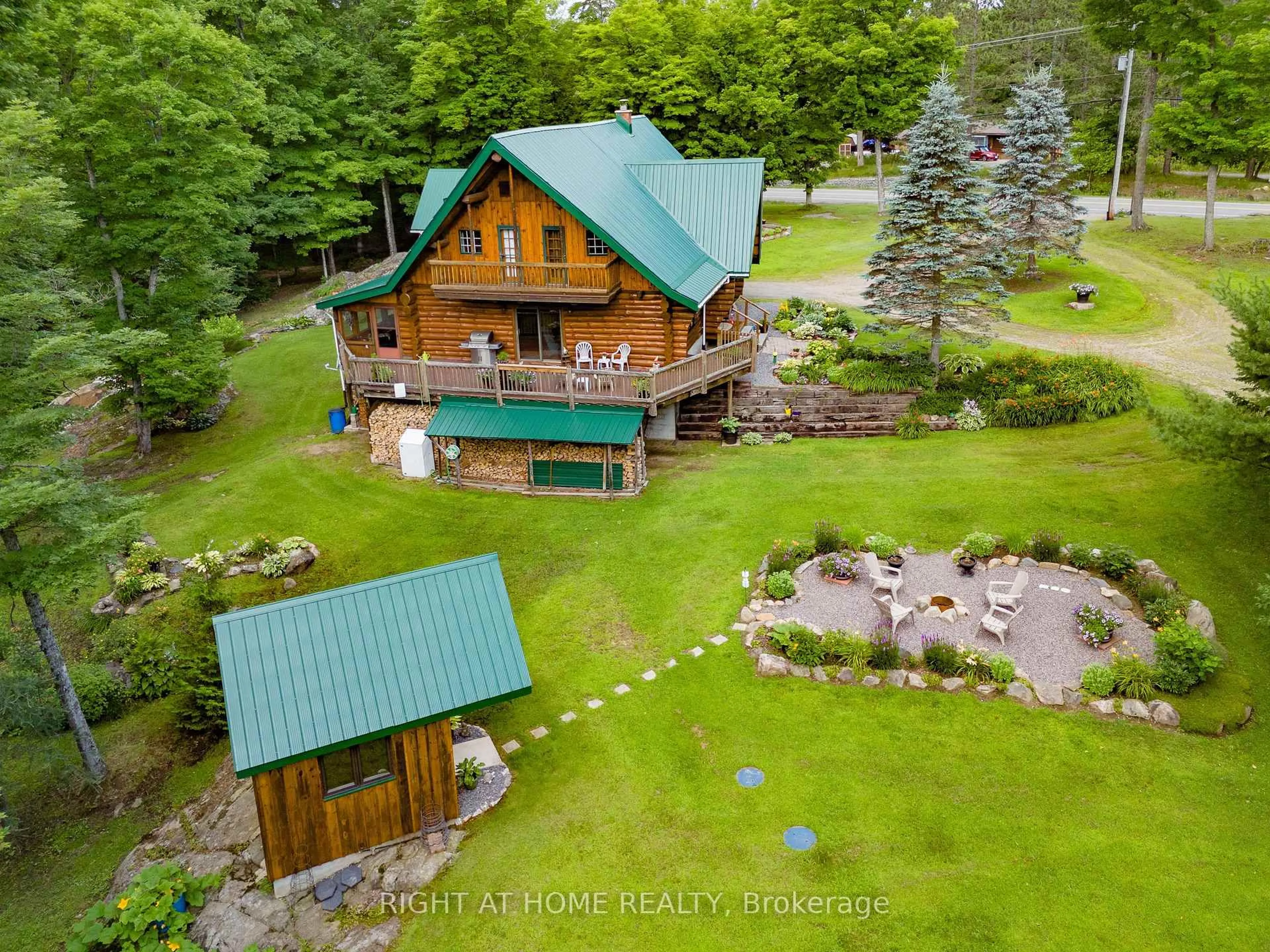 A pic from outside/outdoor area/front of a property/back of a property/a pic from drone, water/lake/river/ocean view for 1696 Highway 118, Bracebridge Ontario P1L 1X1