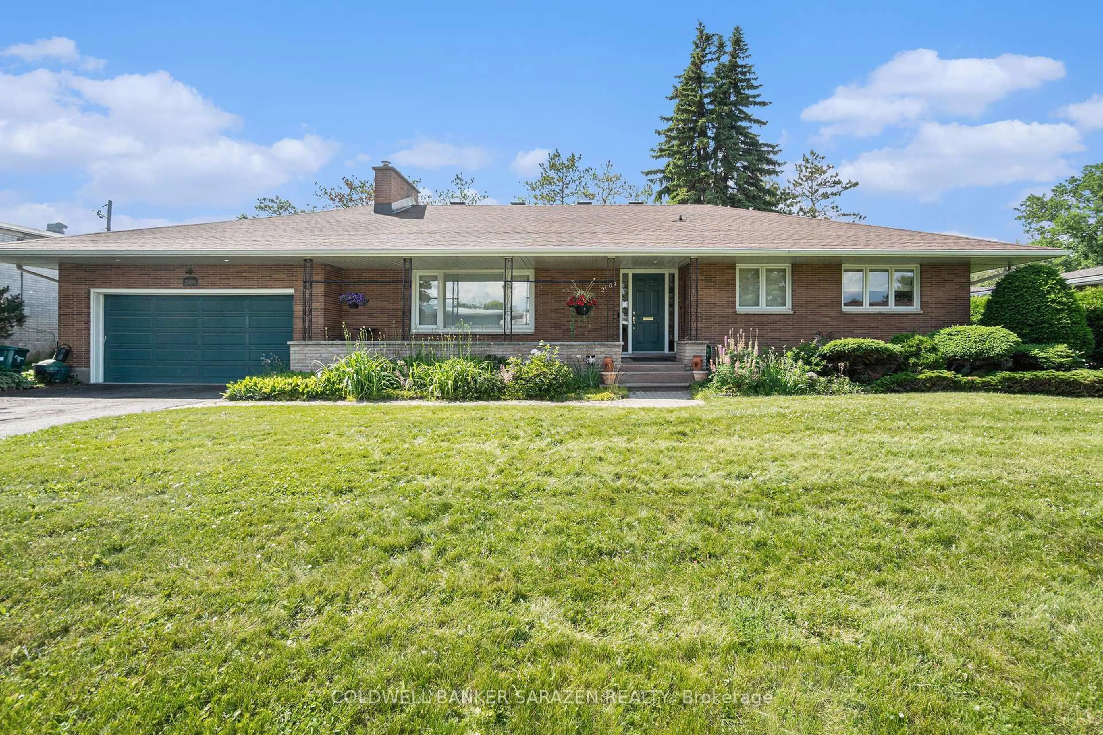 Home with brick exterior material, street for 2009 Killarney Dr, Ottawa Ontario K2A 1P9