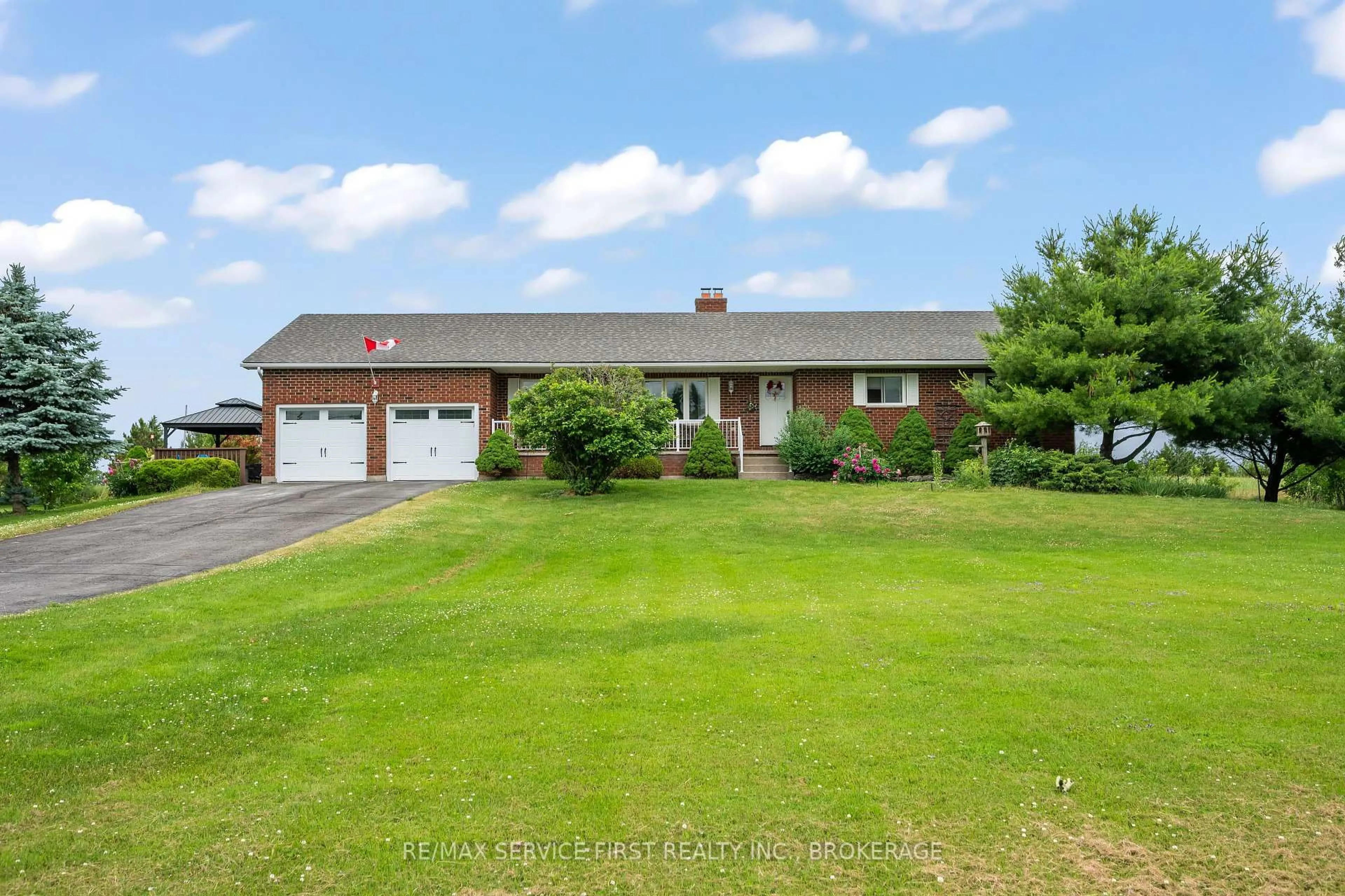 A pic from outside/outdoor area/front of a property/back of a property/a pic from drone, street for 1059 County Rd 11 Rd, Plantagenet Ontario K7R 3L2