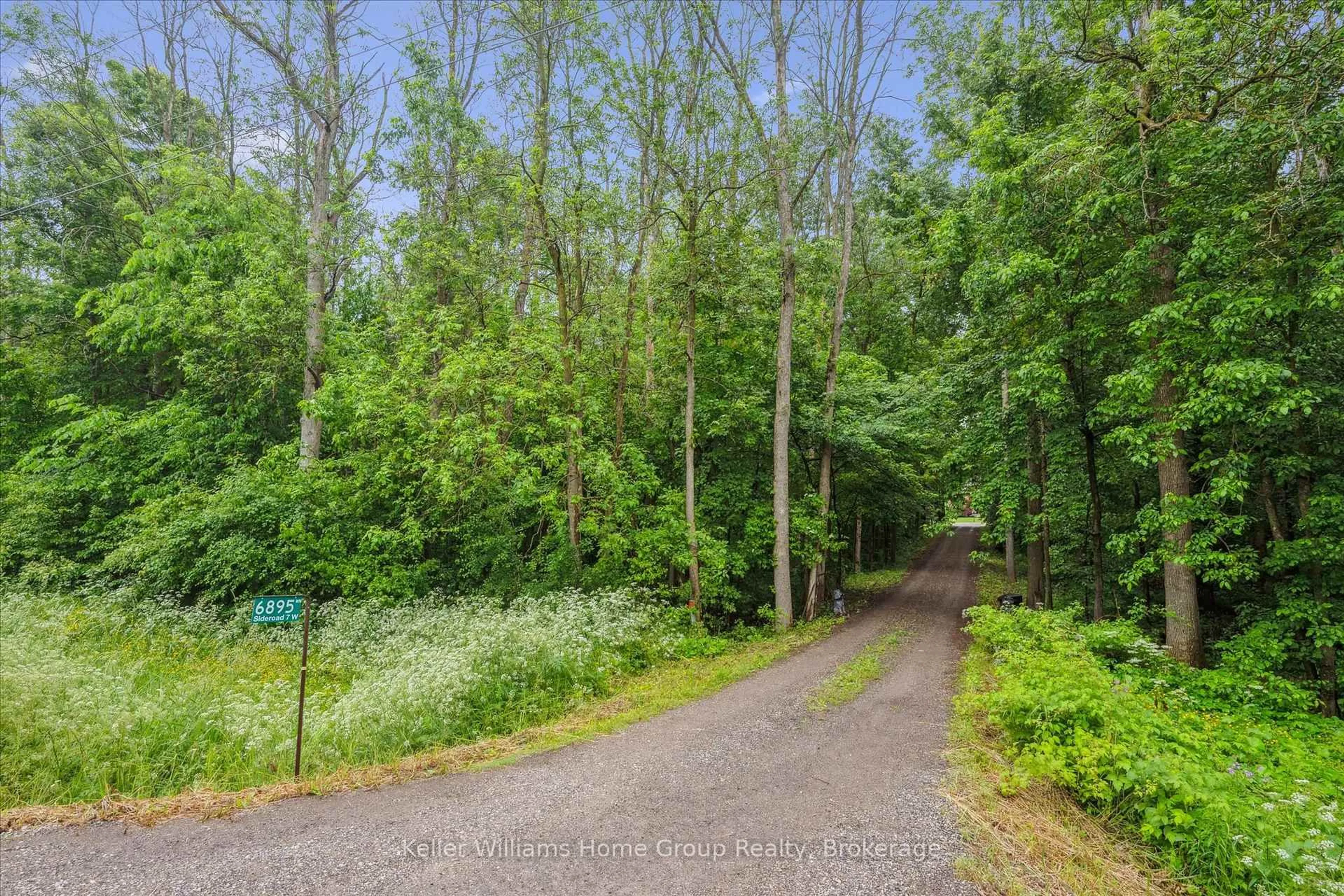 A pic from outside/outdoor area/front of a property/back of a property/a pic from drone, forest/trees view for 6895 Sideroad 7 West Sdrd, Wellington North Ontario N0G 2C0