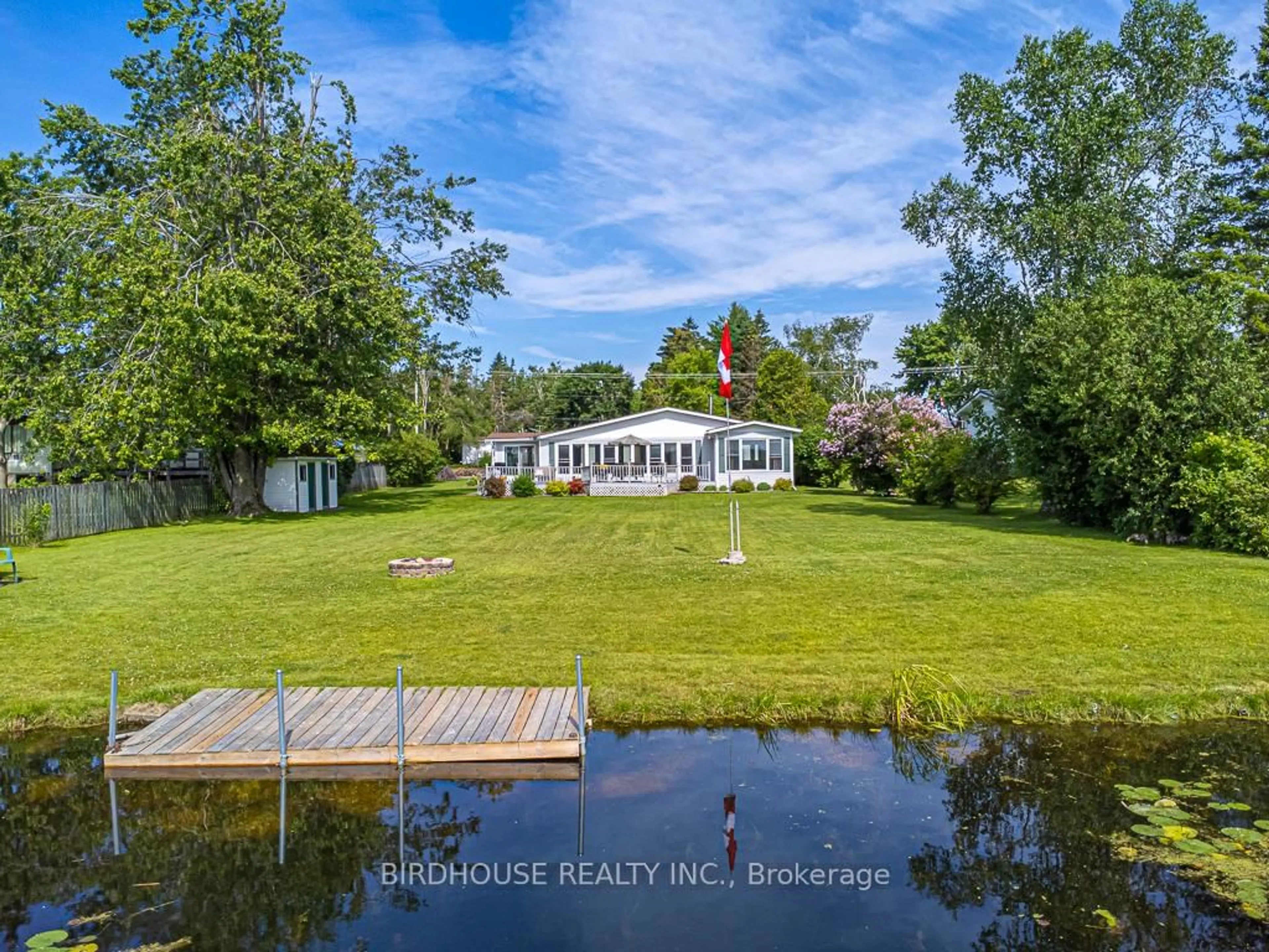 A pic from outside/outdoor area/front of a property/back of a property/a pic from drone, water/lake/river/ocean view for 132 Fenelon Dr, Kawartha Lakes Ontario K0M 1G0