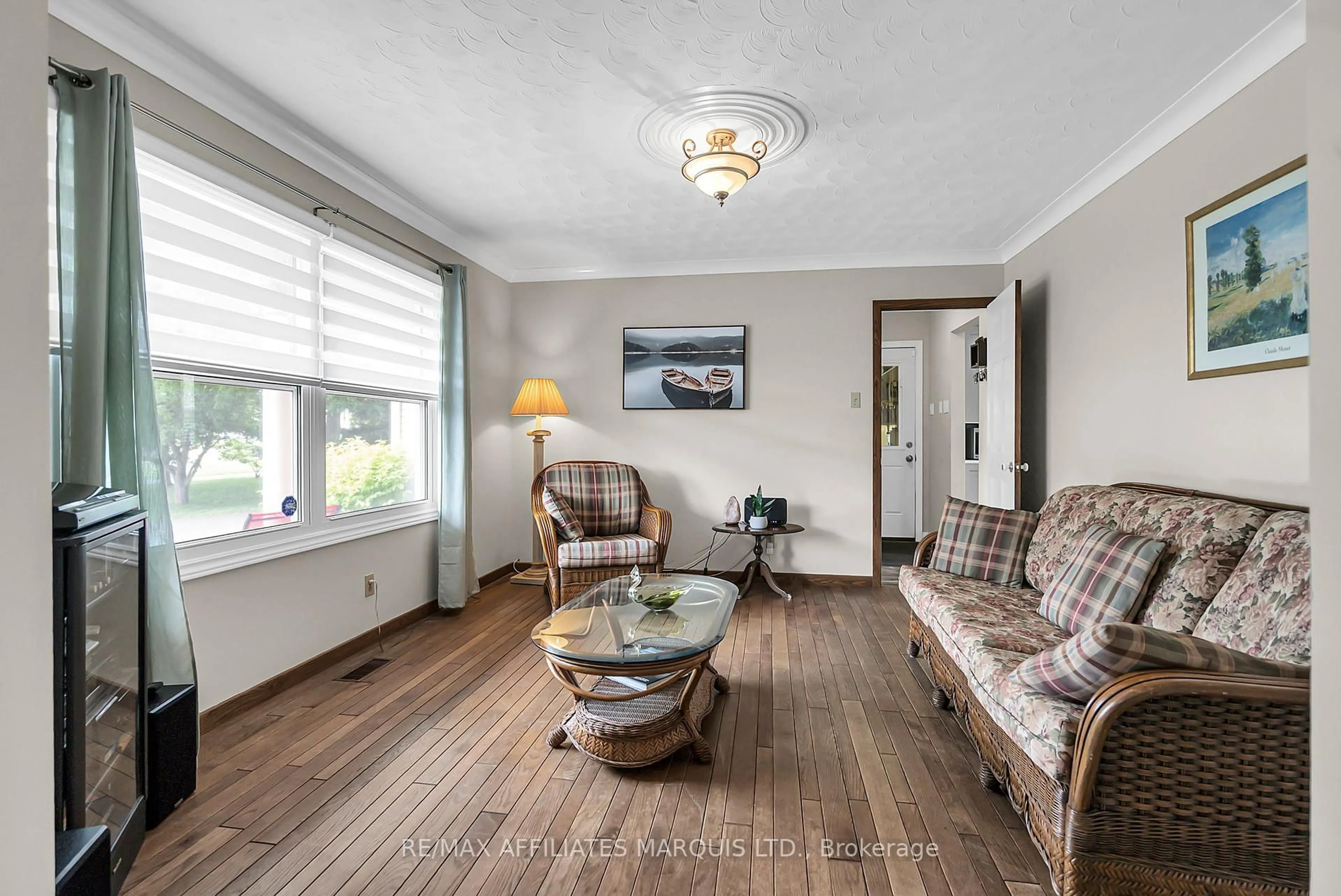 Living room with furniture, wood/laminate floor for 1356 Lochiel St, Cornwall Ontario K6H 6N2