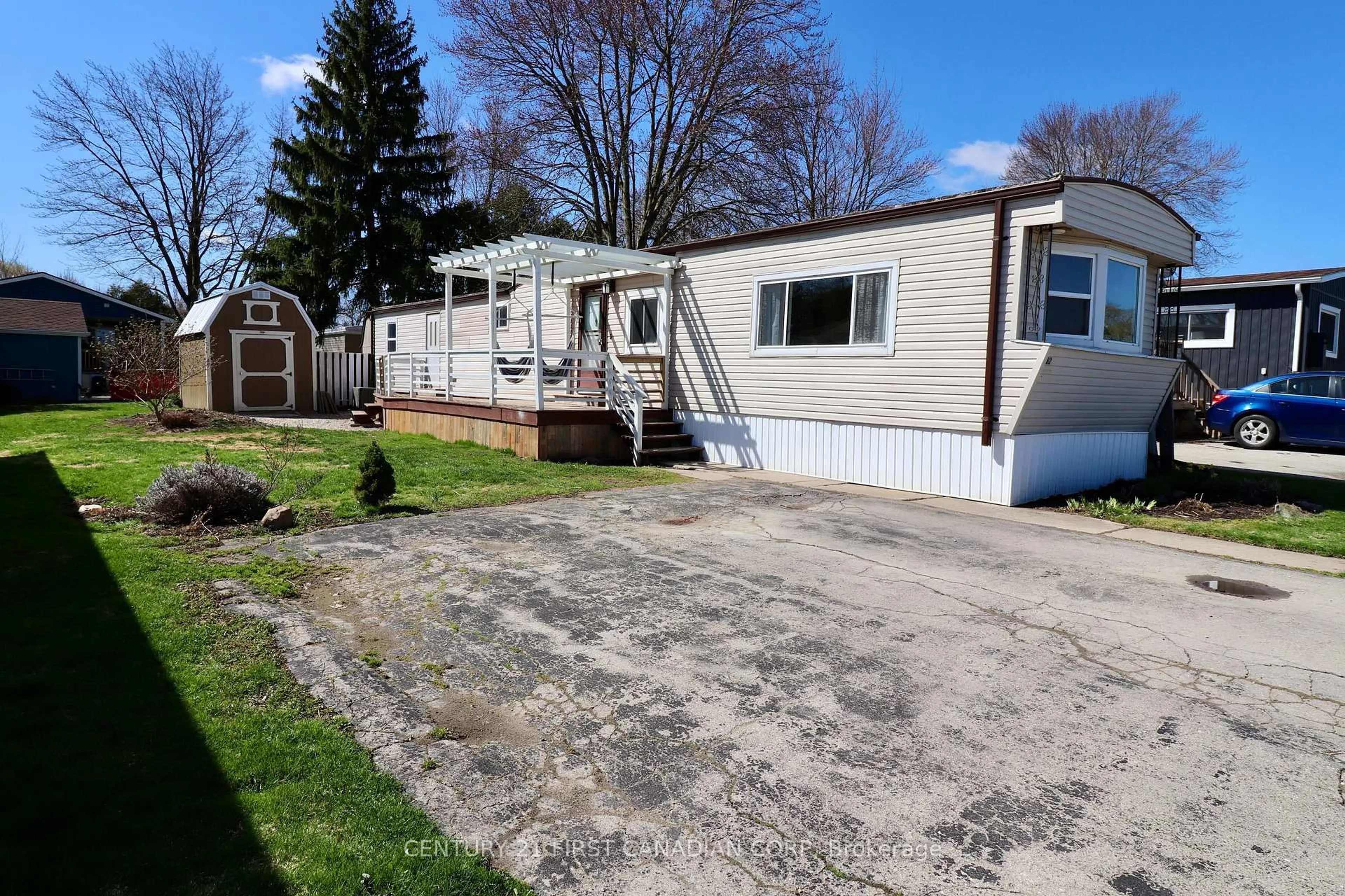 Home with vinyl exterior material, street for 3100 Dorchester Rd #82, Thames Centre Ontario N0L 1G5