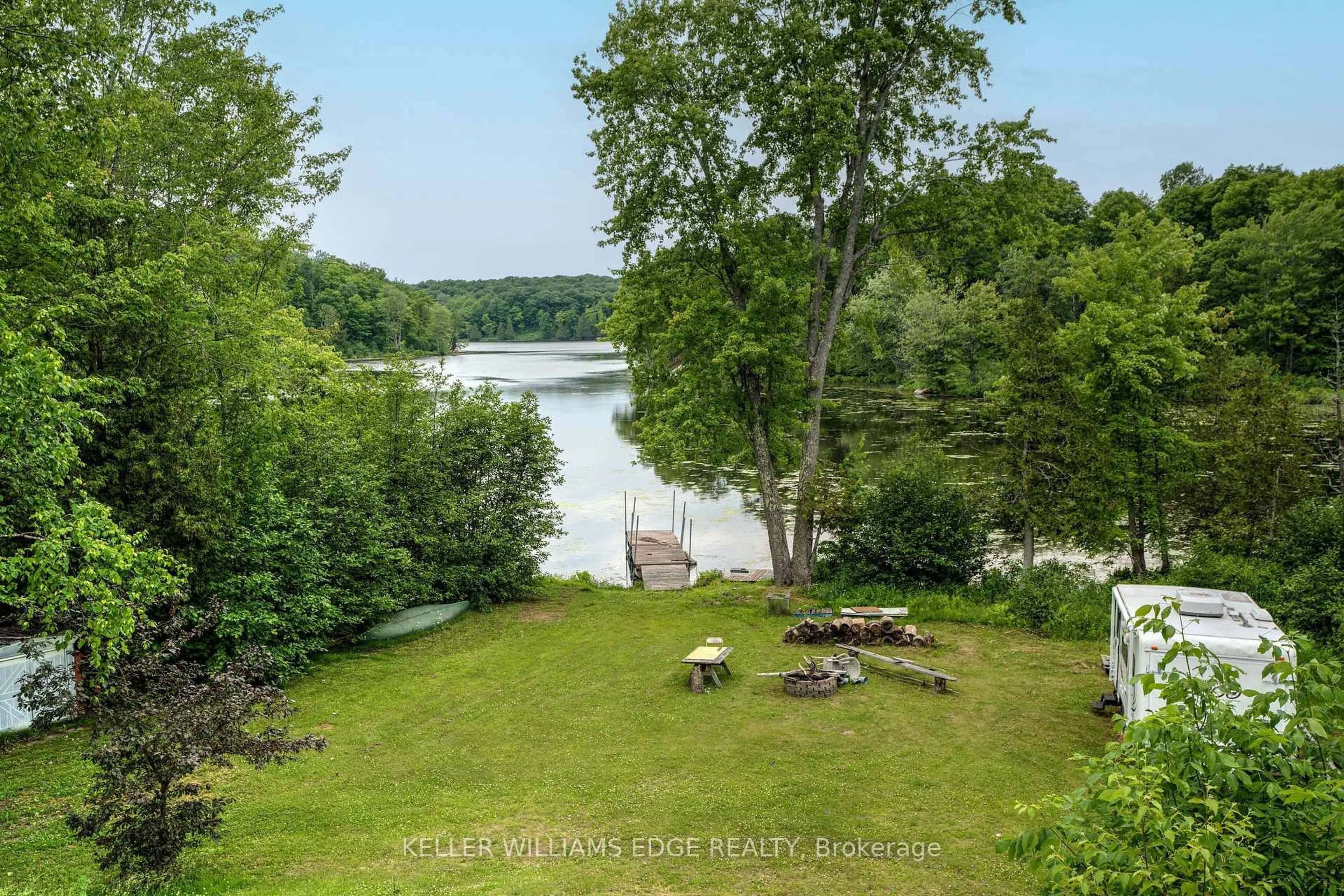 A pic from outside/outdoor area/front of a property/back of a property/a pic from drone, water/lake/river/ocean view for 1180 Guigue Rd, Sharbot Lake Ontario K0H 2P0