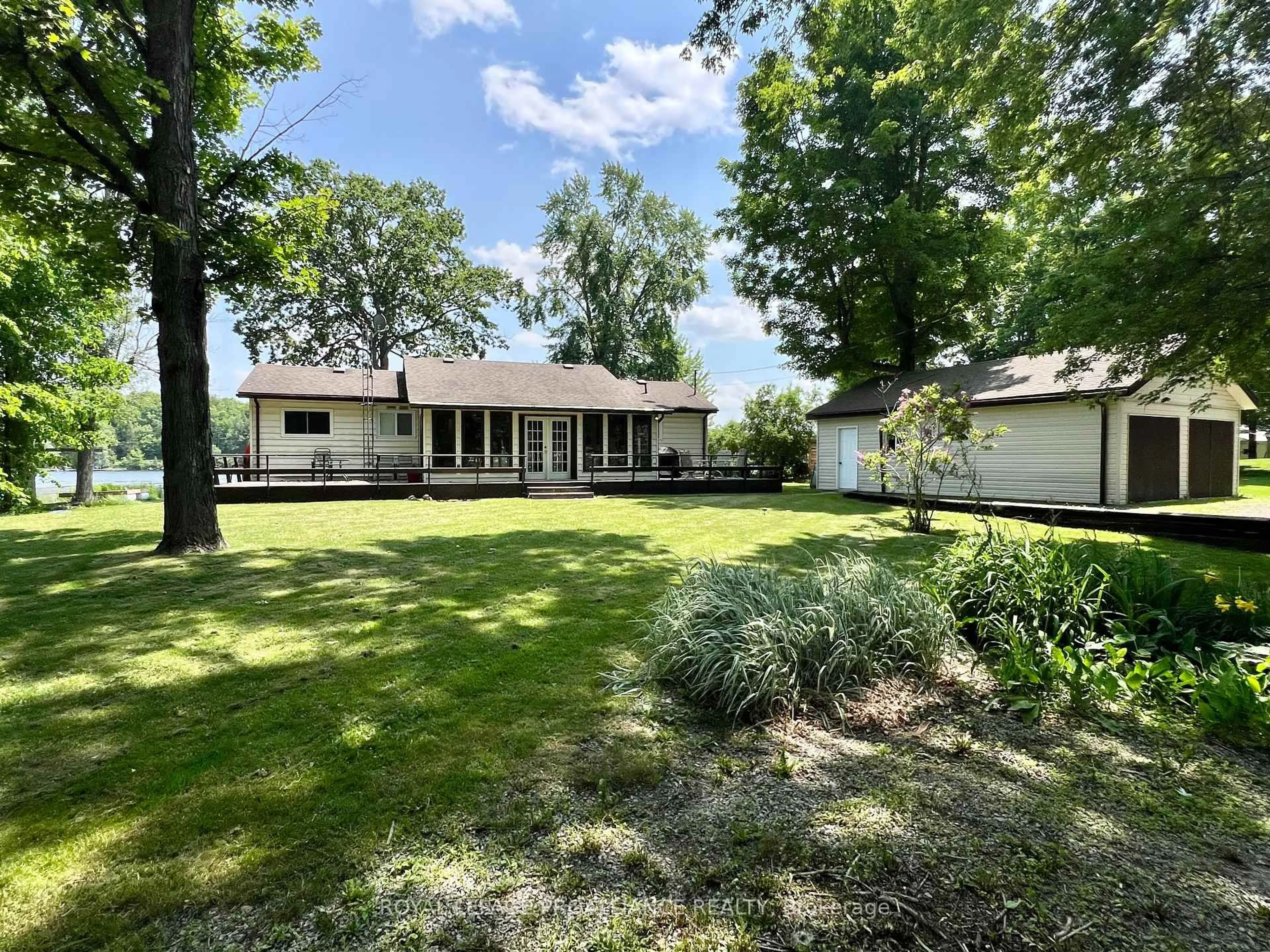 A pic from outside/outdoor area/front of a property/back of a property/a pic from drone, water/lake/river/ocean view for 579 Pine Point Lane, Madoc Ontario K0K 2K0