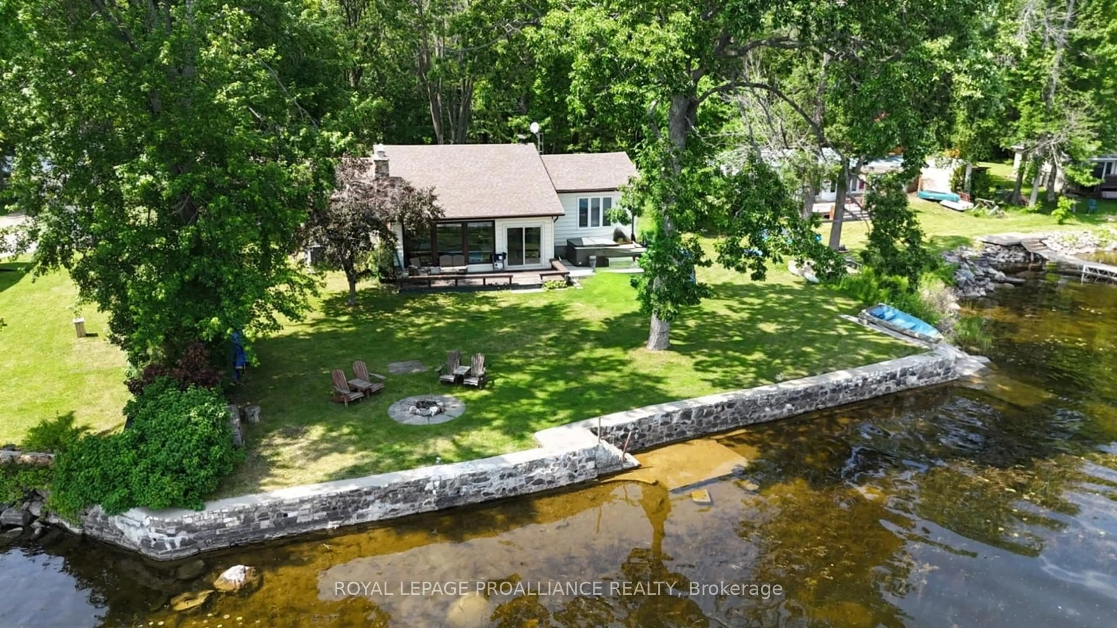 A pic from outside/outdoor area/front of a property/back of a property/a pic from drone, water/lake/river/ocean view for 579 Pine Point Lane, Madoc Ontario K0K 2K0