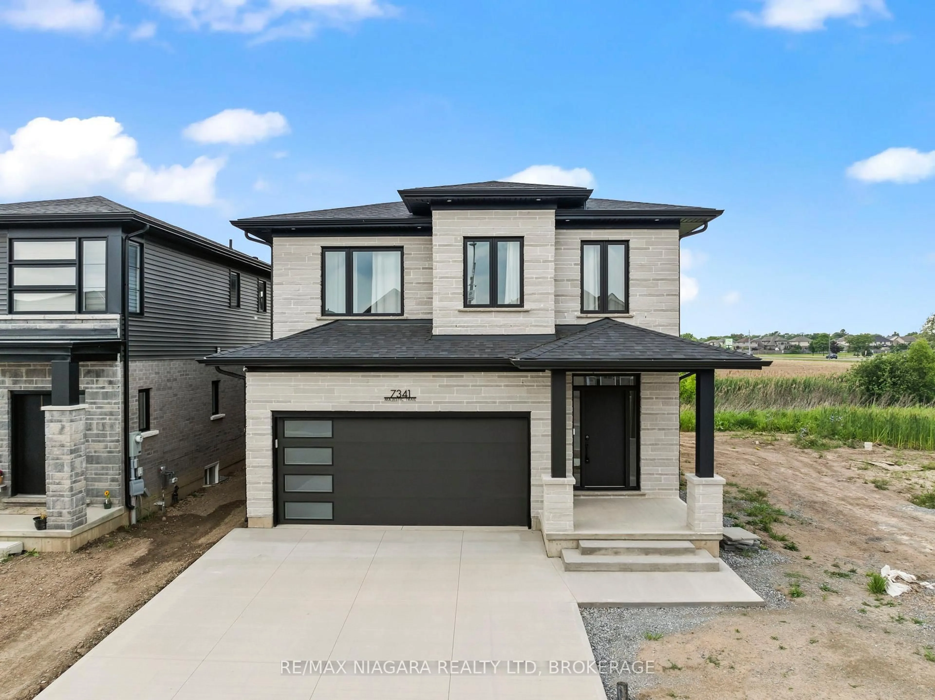Home with brick exterior material, street for 7341 Majestic Tr, Niagara Falls Ontario L2H 0K7