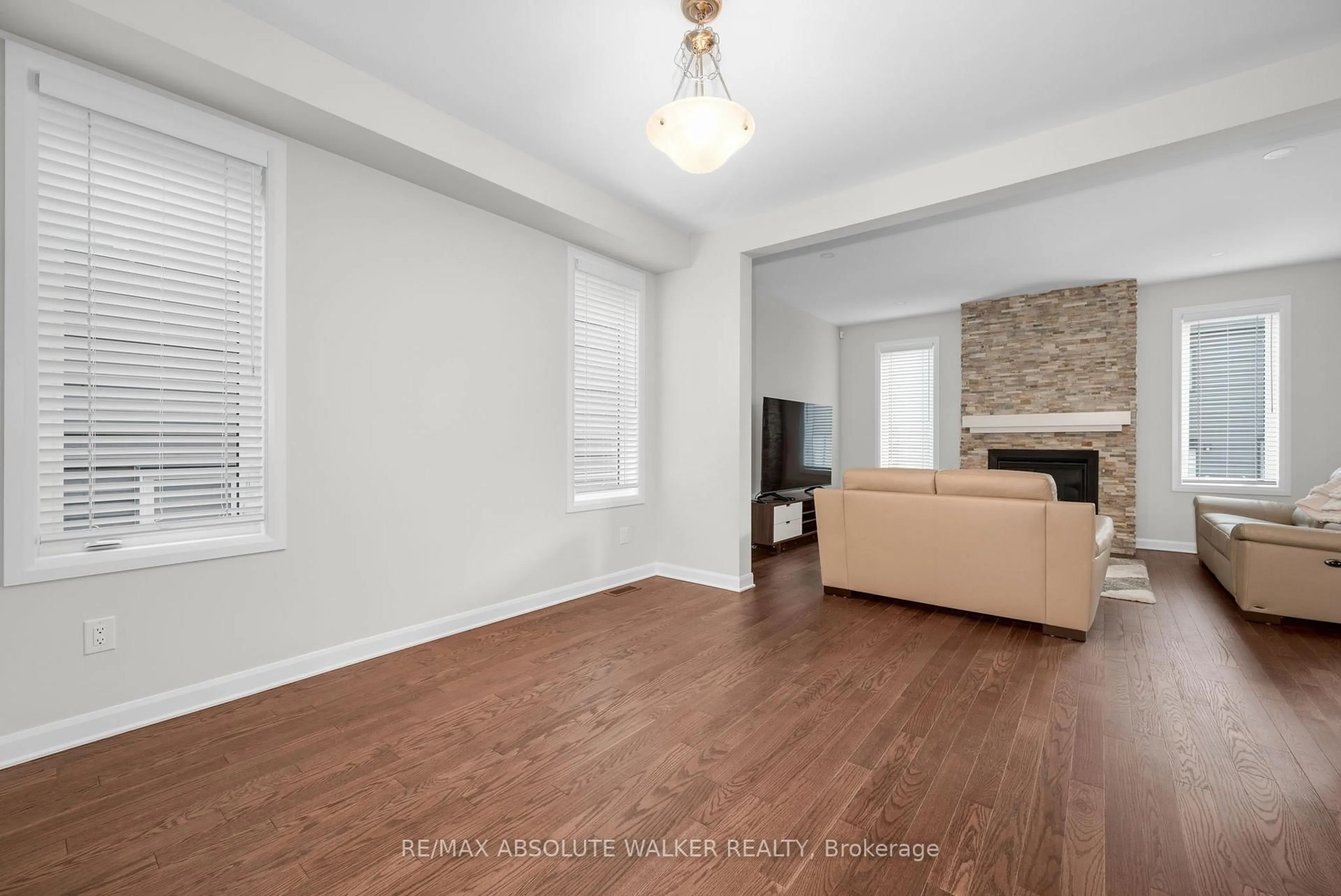 Living room with furniture, wood/laminate floor for 529 Anchor Circ, Ottawa Ontario K4M 0X5