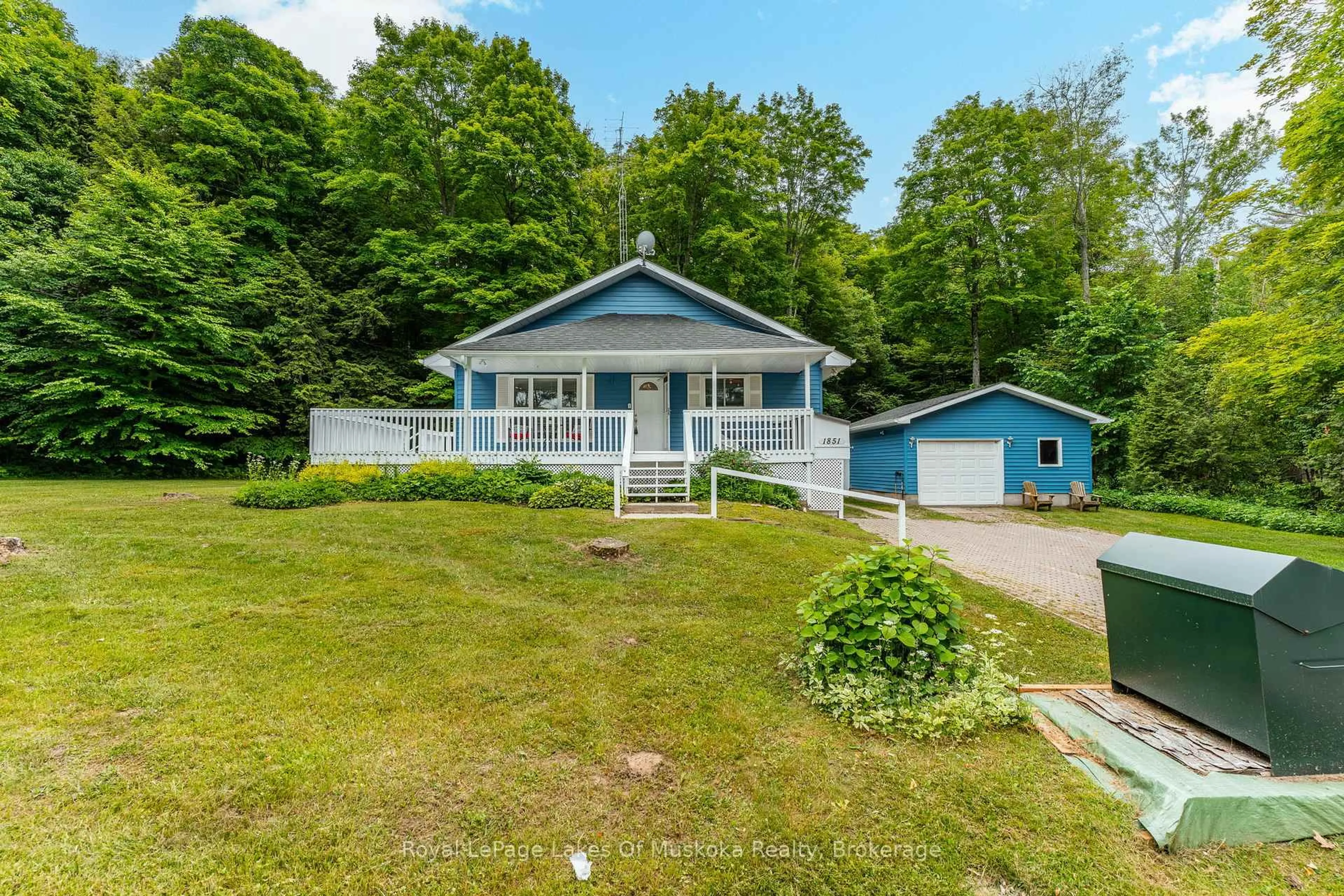 A pic from outside/outdoor area/front of a property/back of a property/a pic from drone, water/lake/river/ocean view for 1851 Cedar Lane, Bracebridge Ontario P1L 1W9