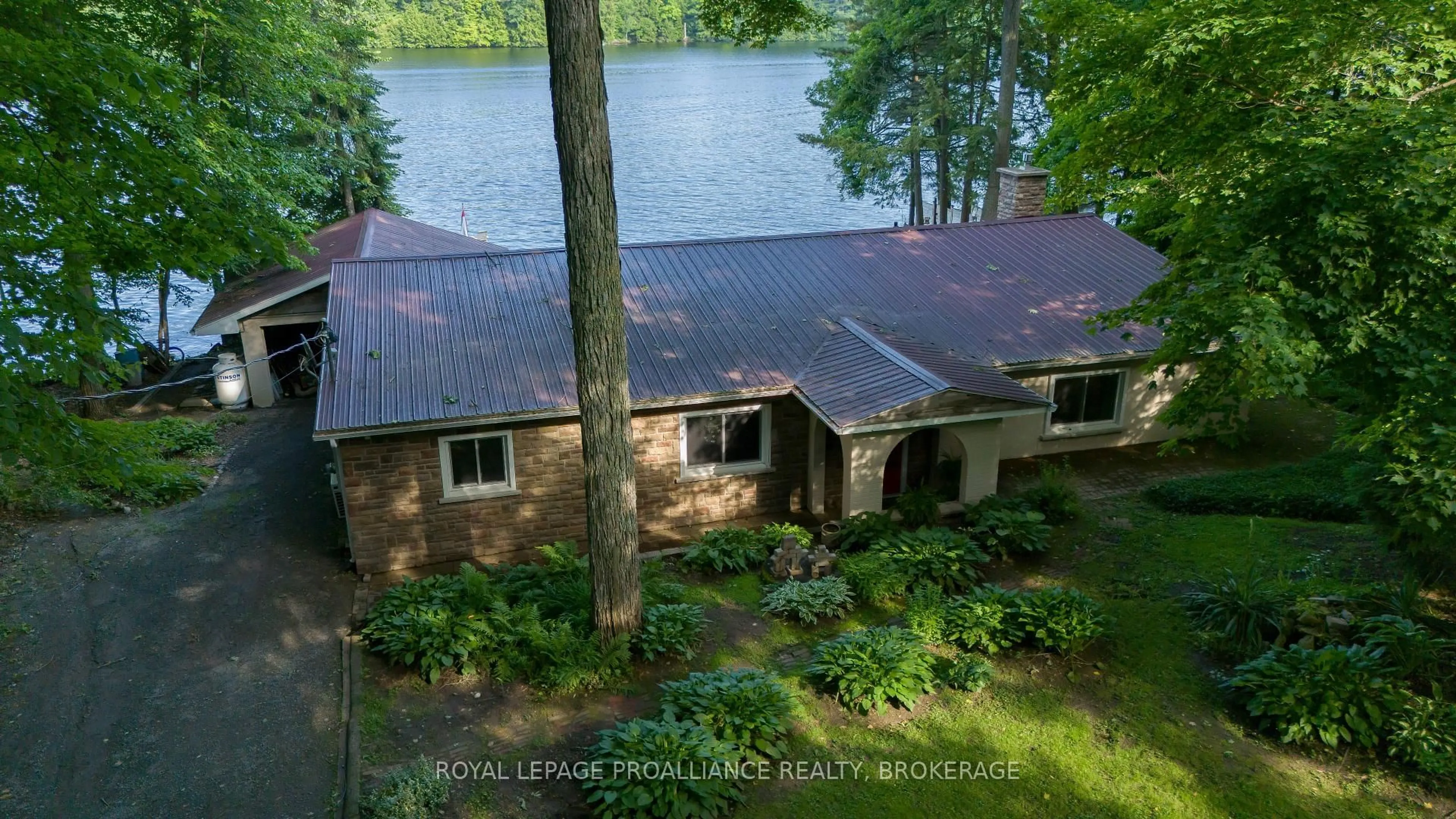 A pic from outside/outdoor area/front of a property/back of a property/a pic from drone, water/lake/river/ocean view for 4268 Melody Lodge Lane, Seeley's Bay Ontario K0H 2N0