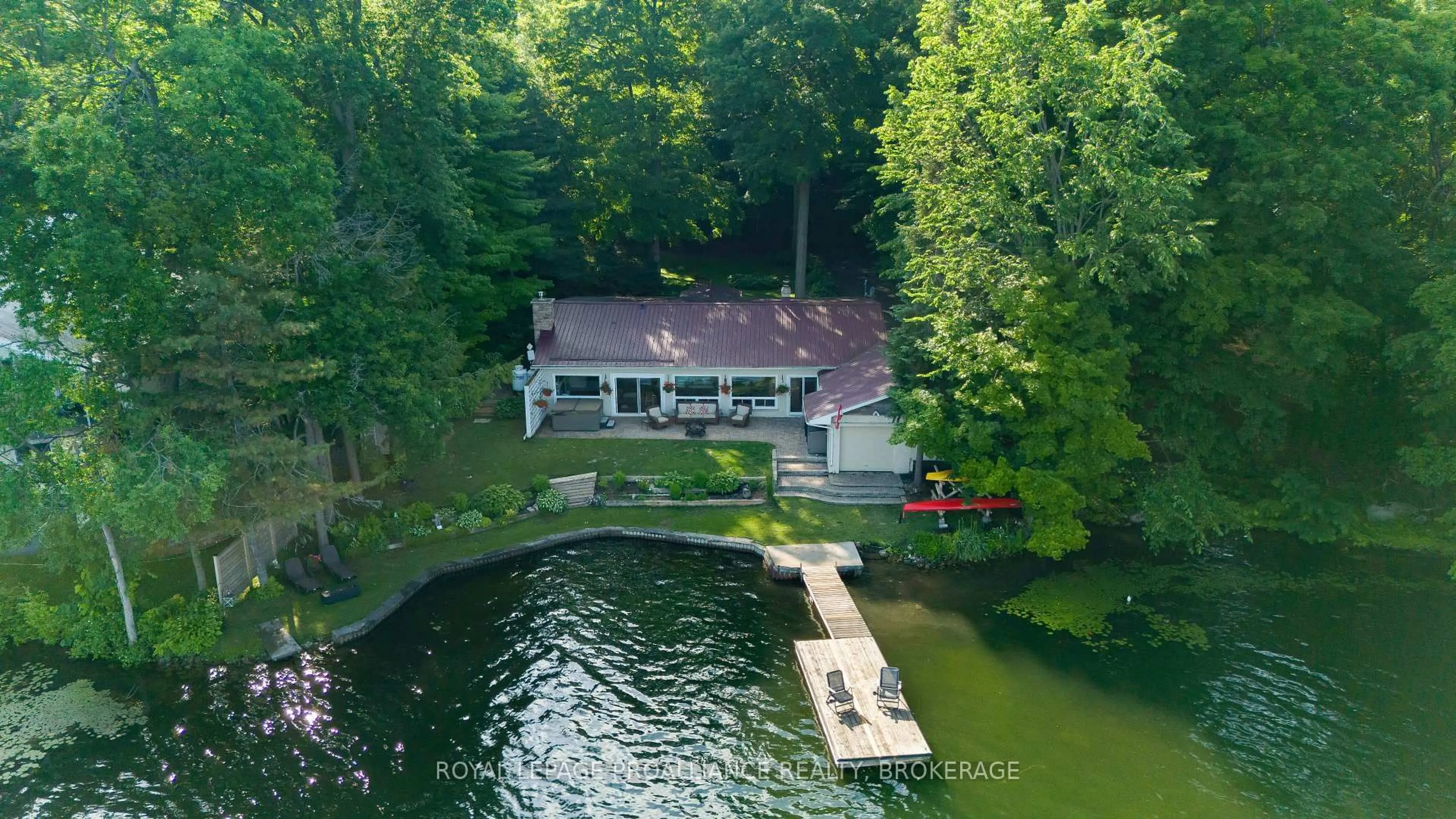 A pic from outside/outdoor area/front of a property/back of a property/a pic from drone, water/lake/river/ocean view for 4268 Melody Lodge Lane, Seeley's Bay Ontario K0H 2N0