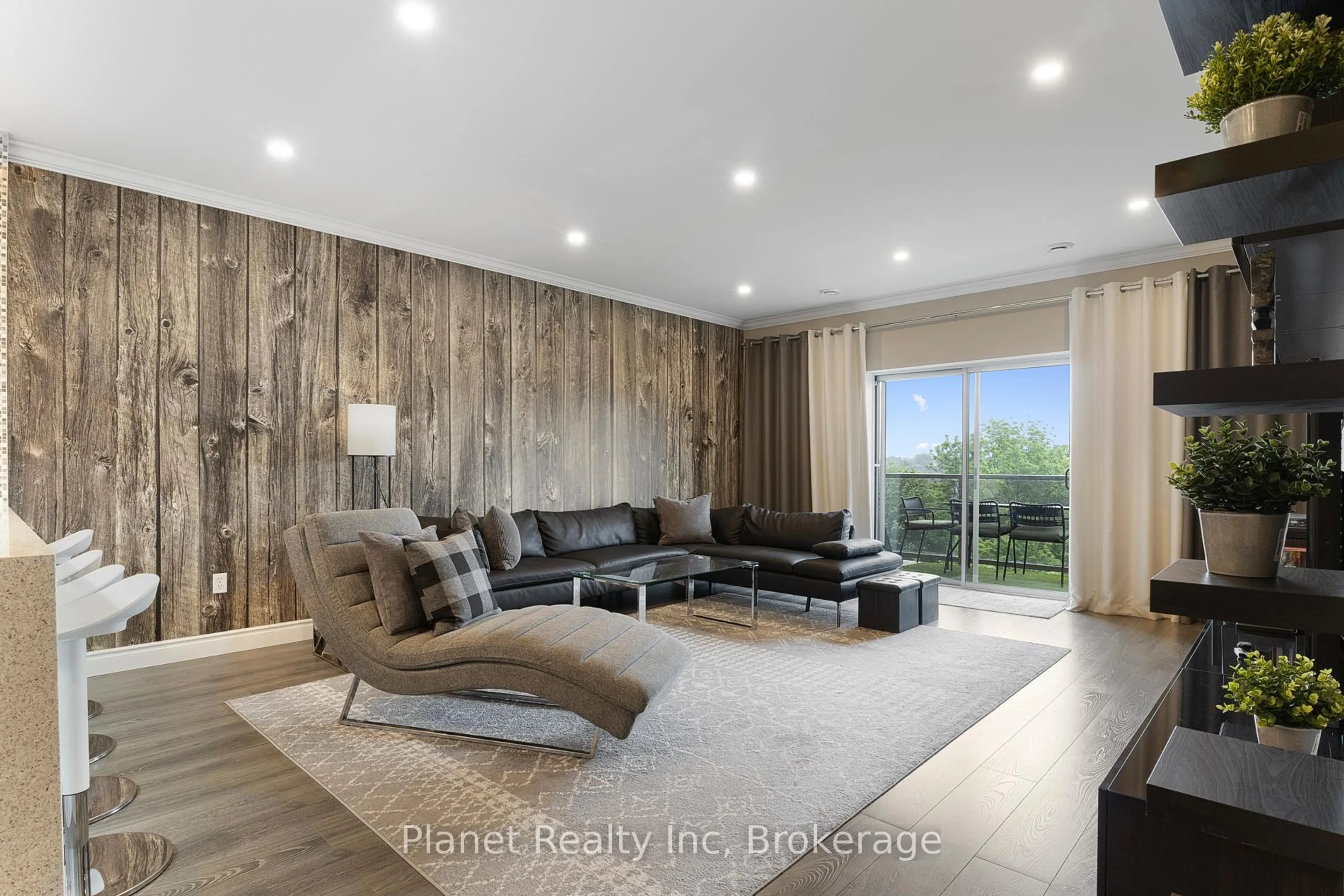 Living room with furniture, wood/laminate floor for 60 Wyndham St #507, Guelph Ontario N1E 7H7