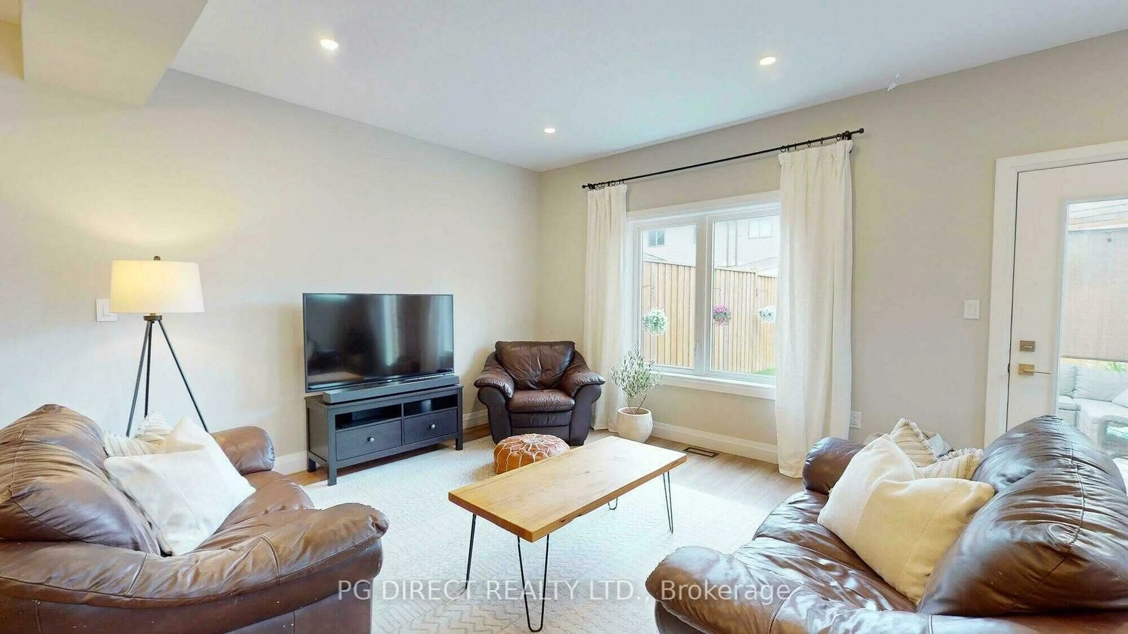 Living room with furniture, wood/laminate floor for 35 Wideman Blvd #1, Guelph Ontario N1E 7L8