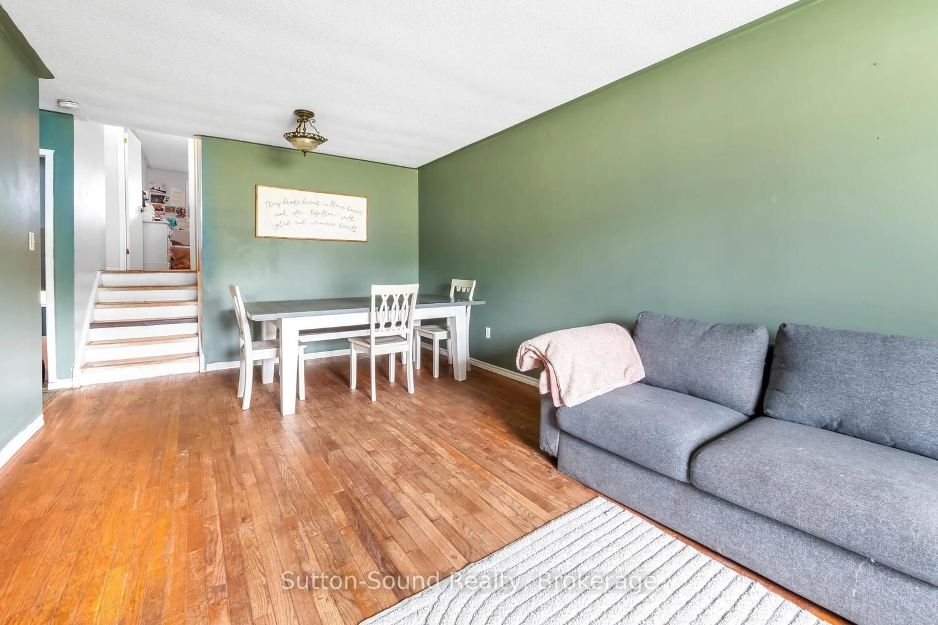 Living room with furniture, wood/laminate floor for 780 Eastwood Dr, Saugeen Shores Ontario N0H 2C4