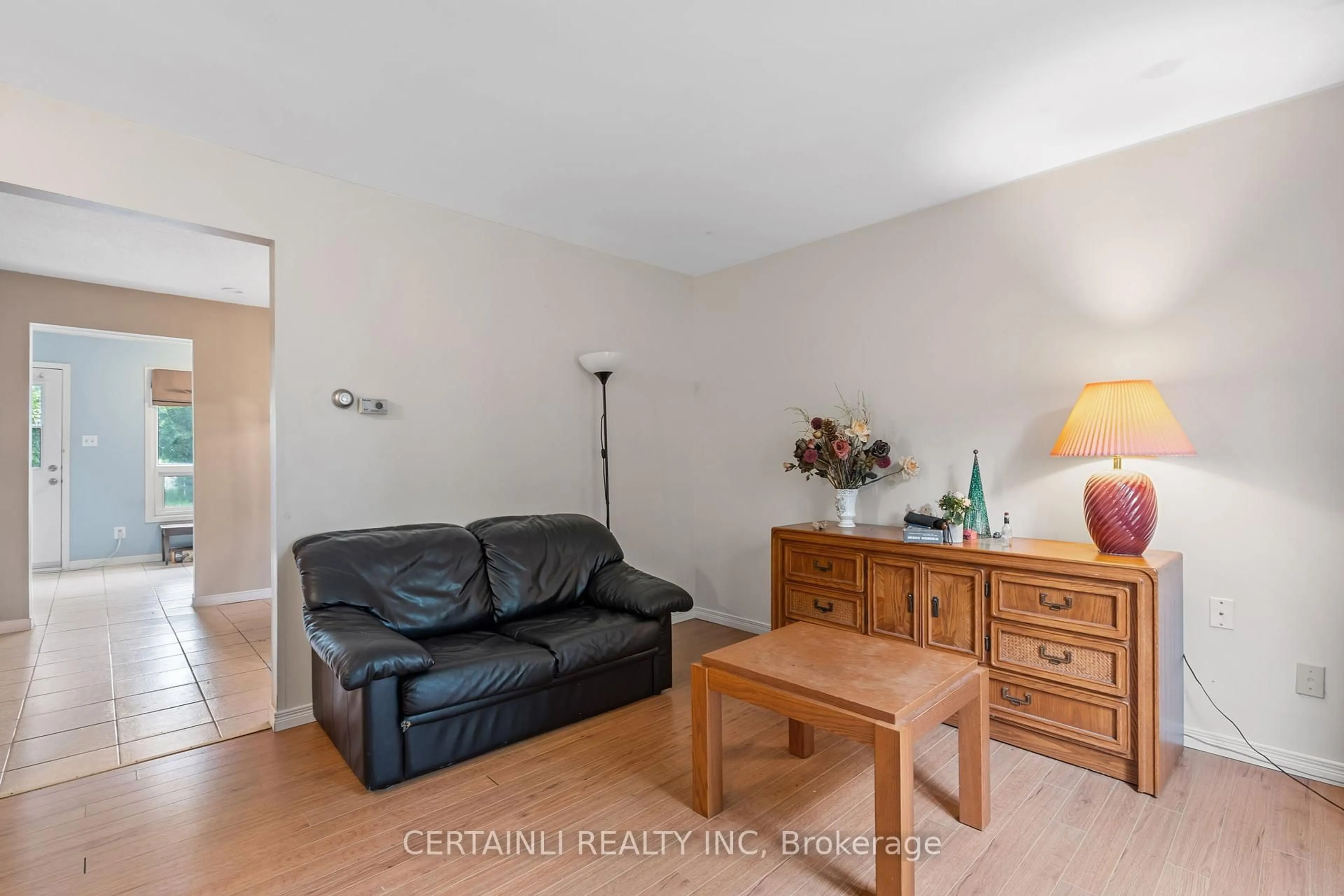 Living room with furniture, wood/laminate floor for 41 Inverary Rd, London North Ontario N6G 3L5