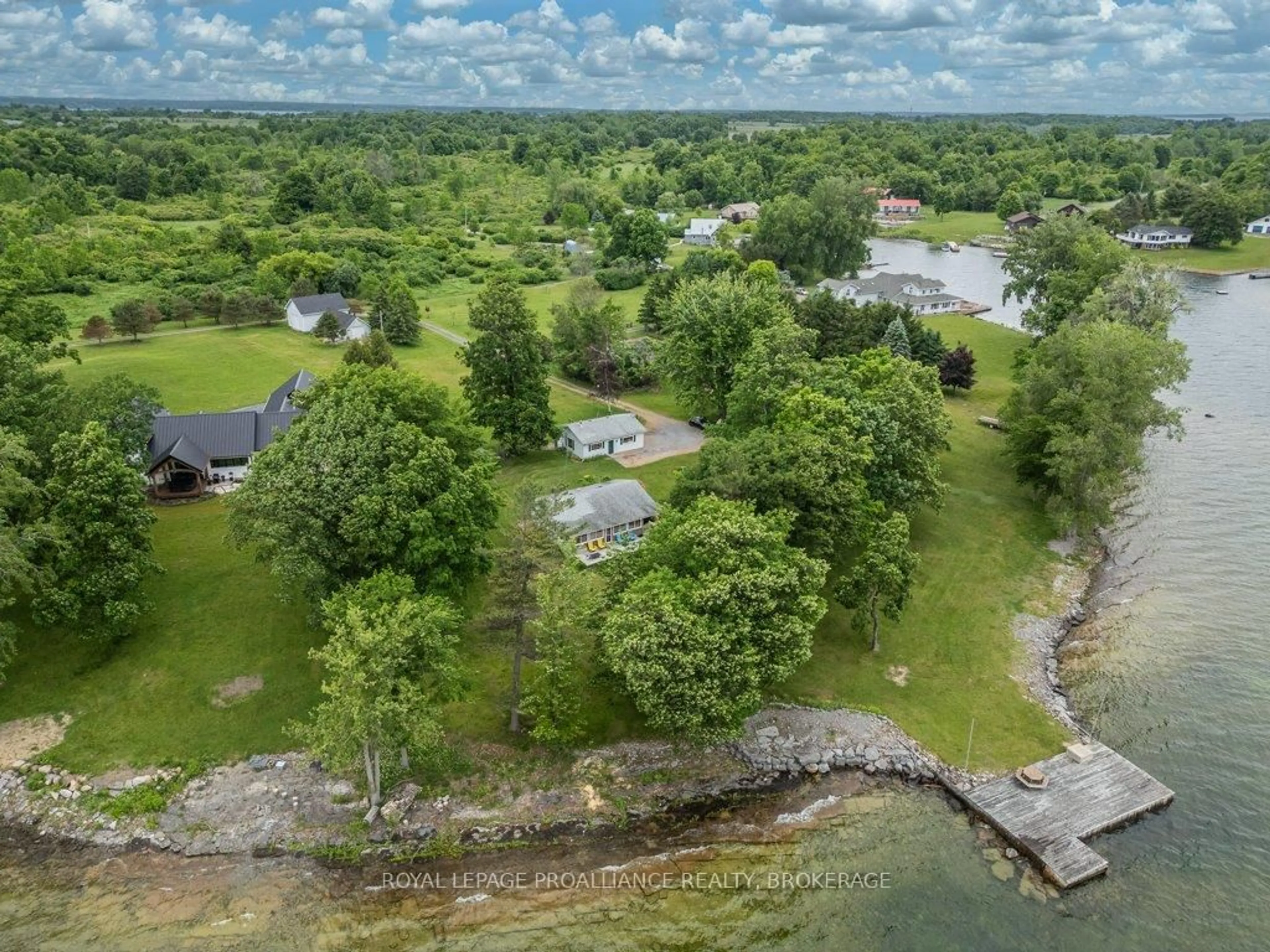A pic from outside/outdoor area/front of a property/back of a property/a pic from drone, water/lake/river/ocean view for 27 Berry Lane, Wolfe Island Ontario K0H 2Y0