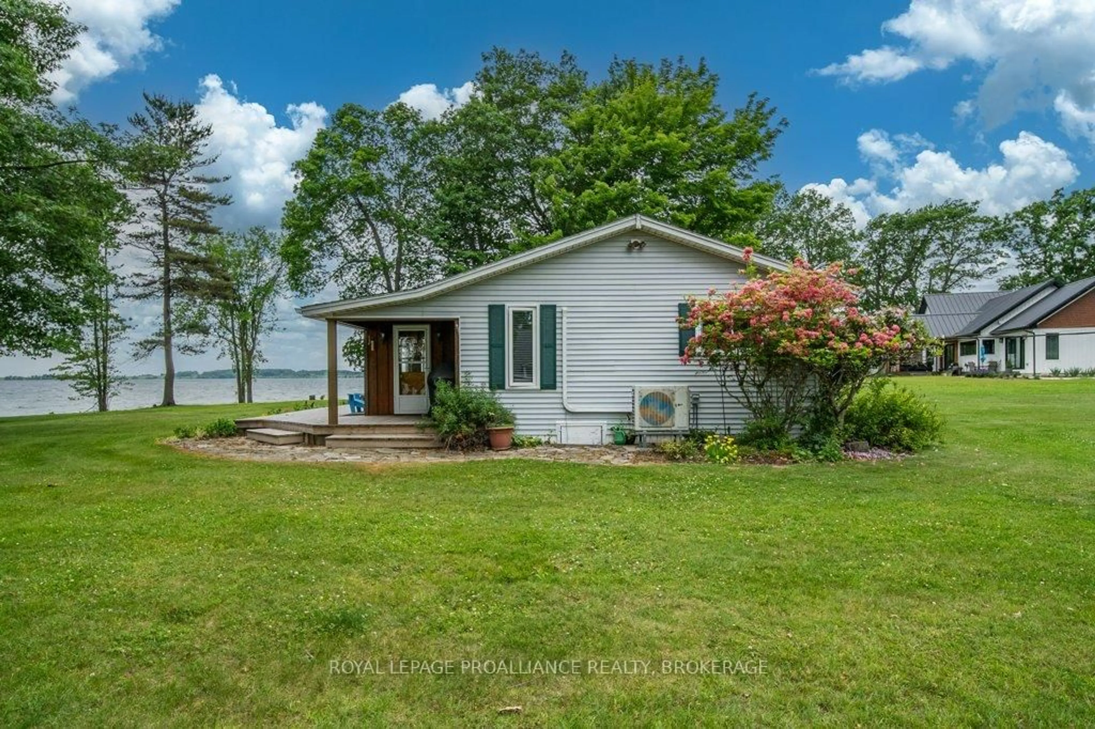 Home with vinyl exterior material, water/lake/river/ocean view for 27 Berry Lane, Wolfe Island Ontario K0H 2Y0