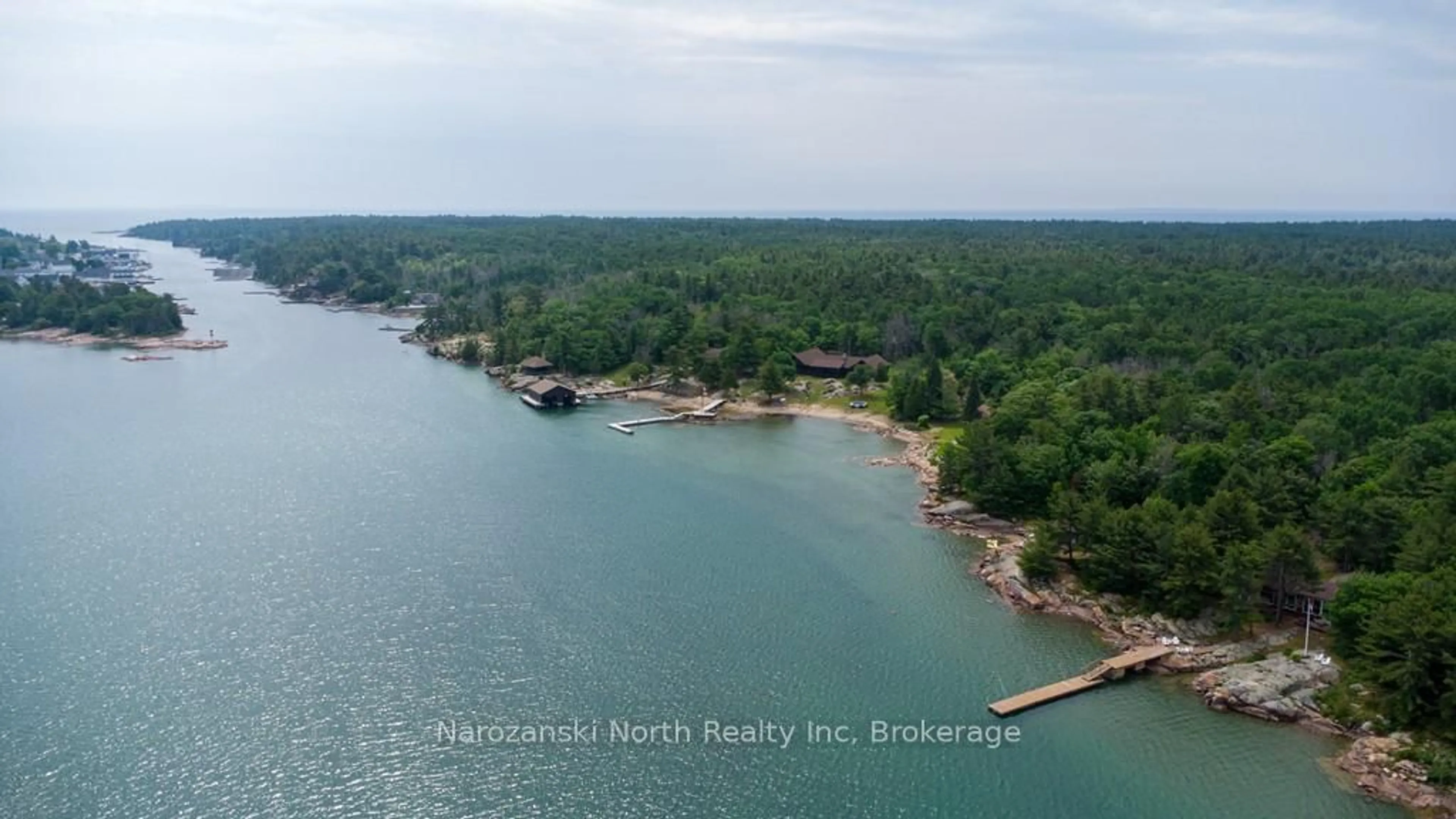 A pic from outside/outdoor area/front of a property/back of a property/a pic from drone, water/lake/river/ocean view for 194 George Island, Killarney Ontario P0M 2A0