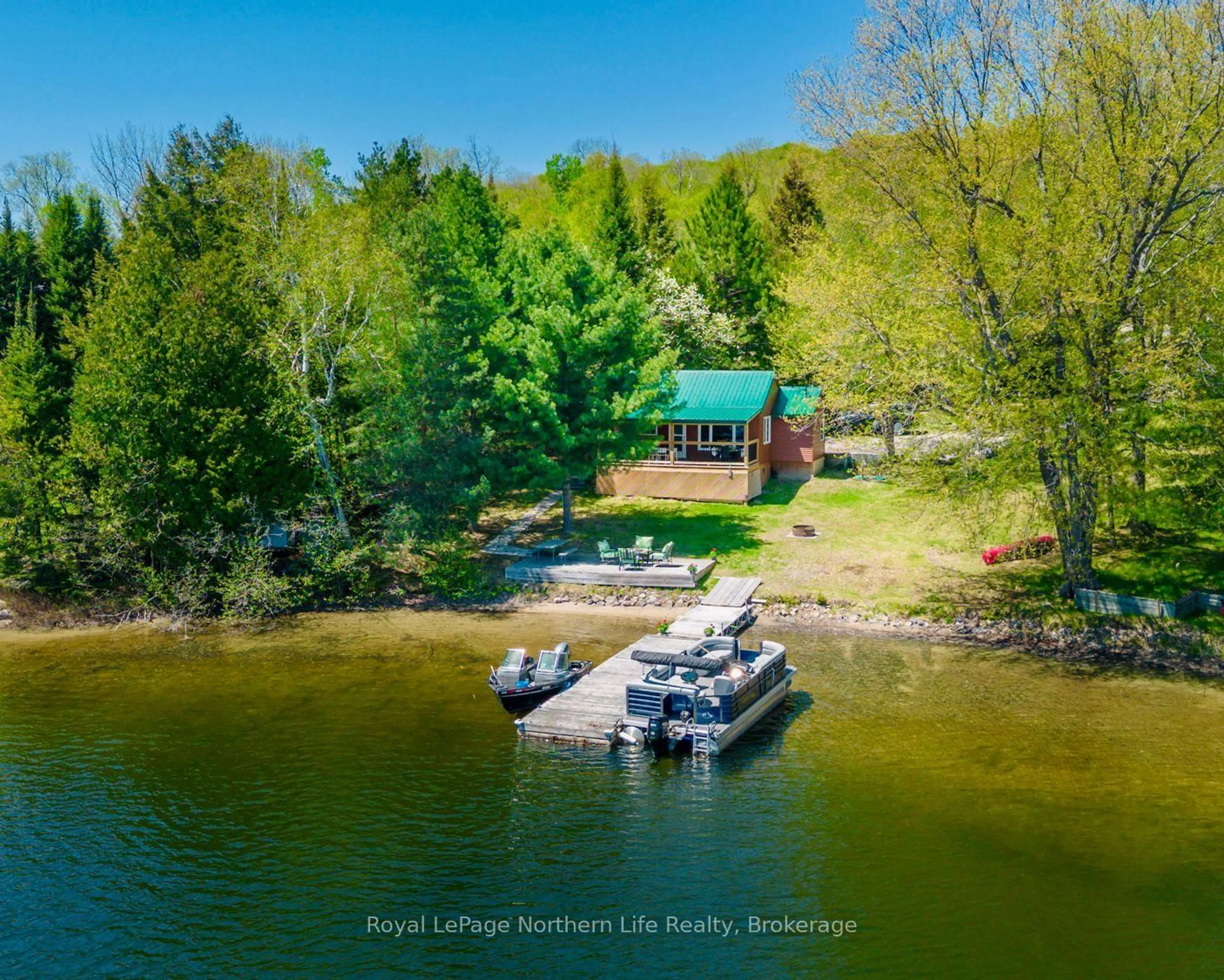 A pic from outside/outdoor area/front of a property/back of a property/a pic from drone, water/lake/river/ocean view for 2251 Peninsula Rd, North Bay Ontario P1B 8G4