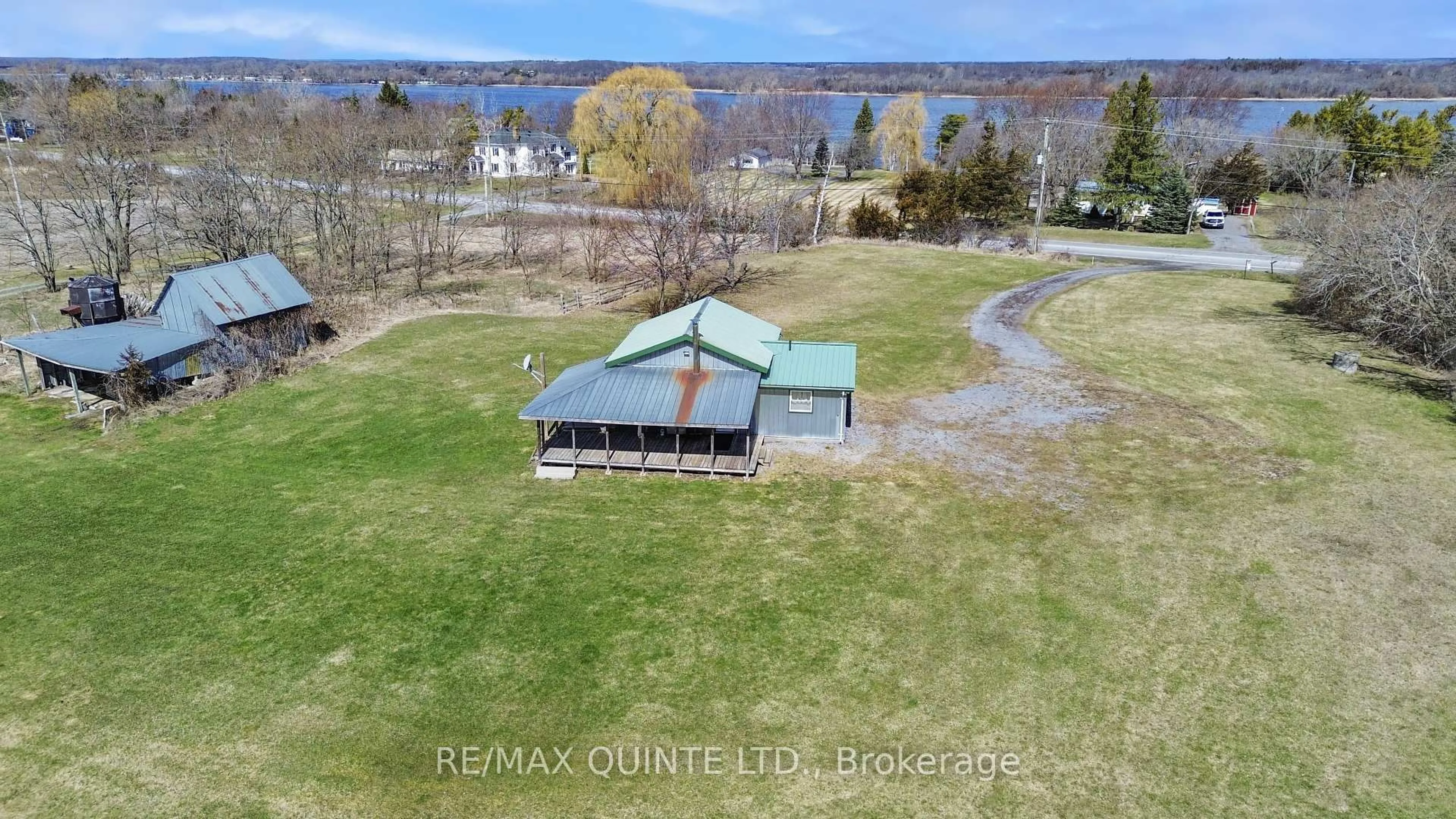 A pic from outside/outdoor area/front of a property/back of a property/a pic from drone, water/lake/river/ocean view for 2878 County Road 15, Prince Edward County Ontario K0K 2T0