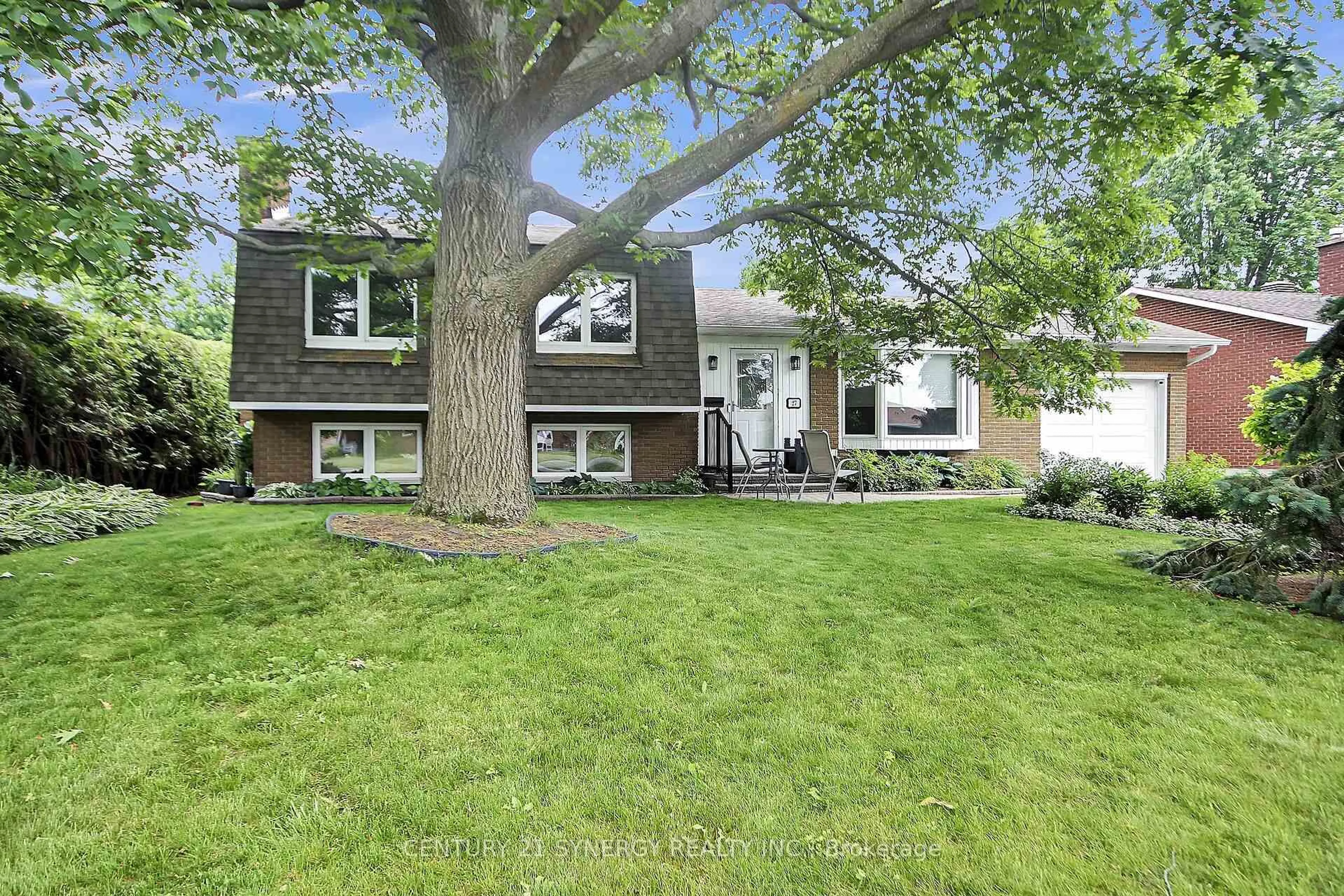 Home with vinyl exterior material, street for 27 Tripp Cres, Barrhaven Ontario K2J 1C5