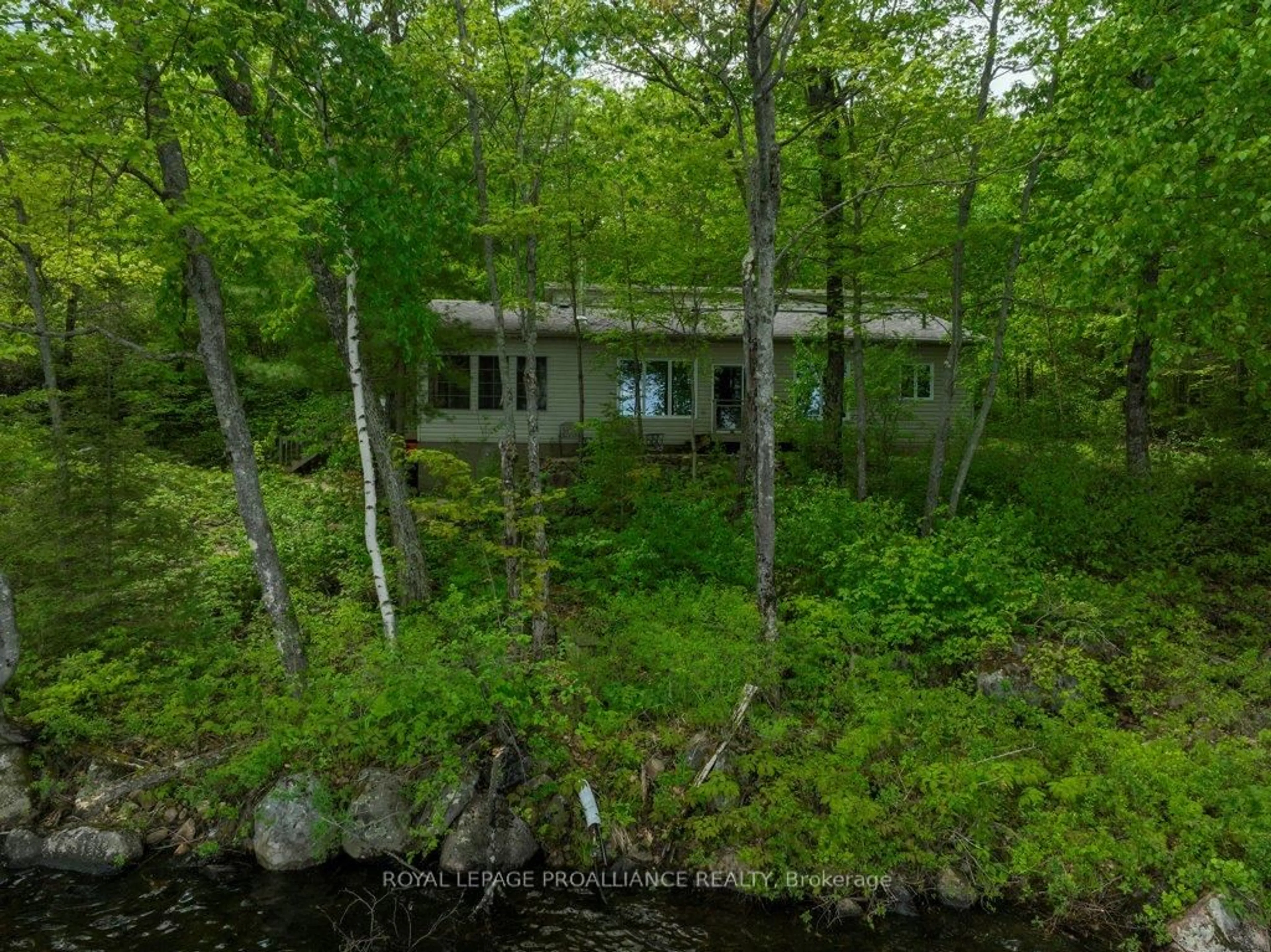 A pic from outside/outdoor area/front of a property/back of a property/a pic from drone, forest/trees view for 3465 Hughes Landing, Cloyne Ontario K0H 1K0