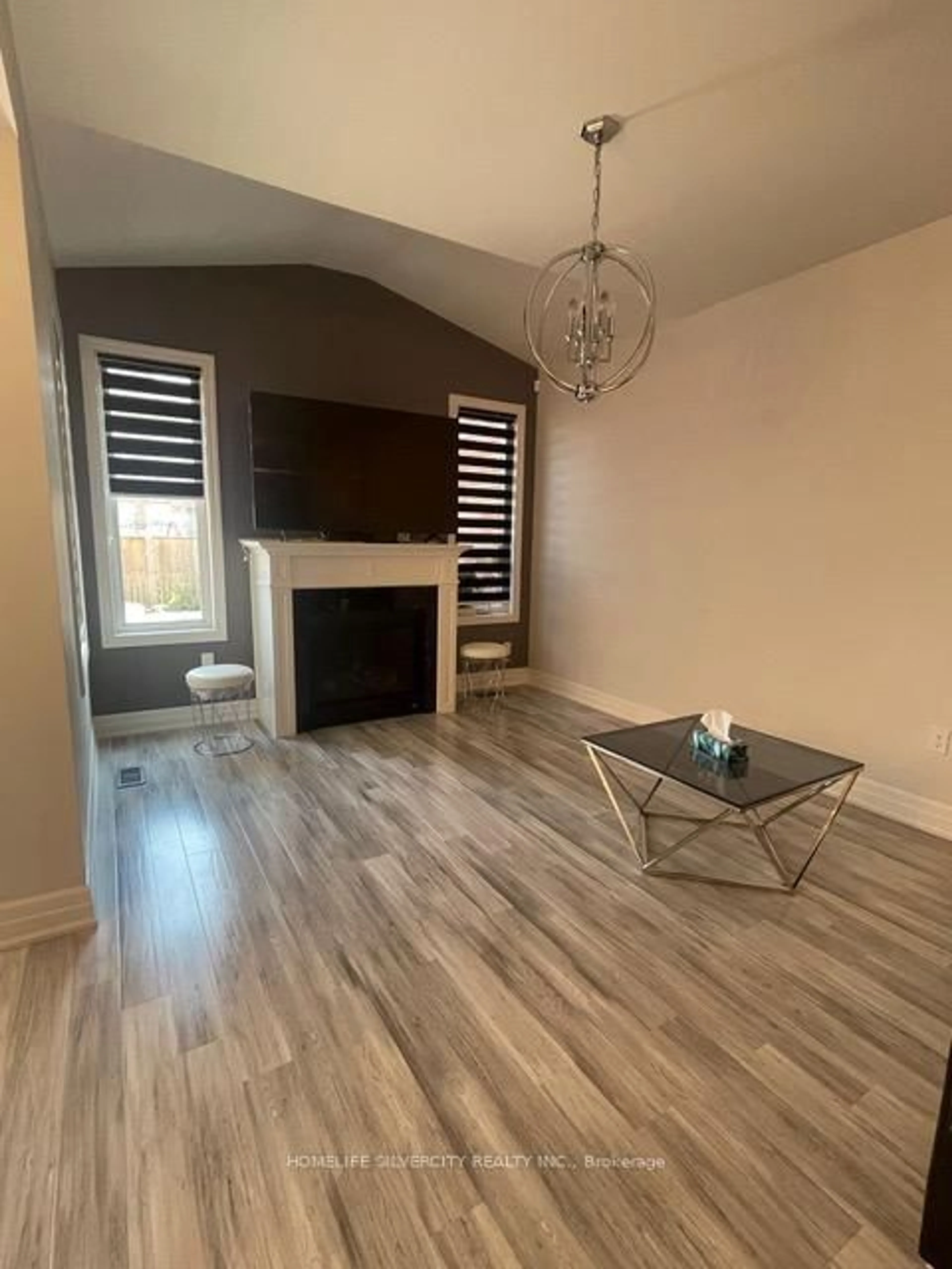 Living room with furniture, wood/laminate floor for 4308 Shuttleworth Dr, Niagara Falls Ontario L2G 0X5
