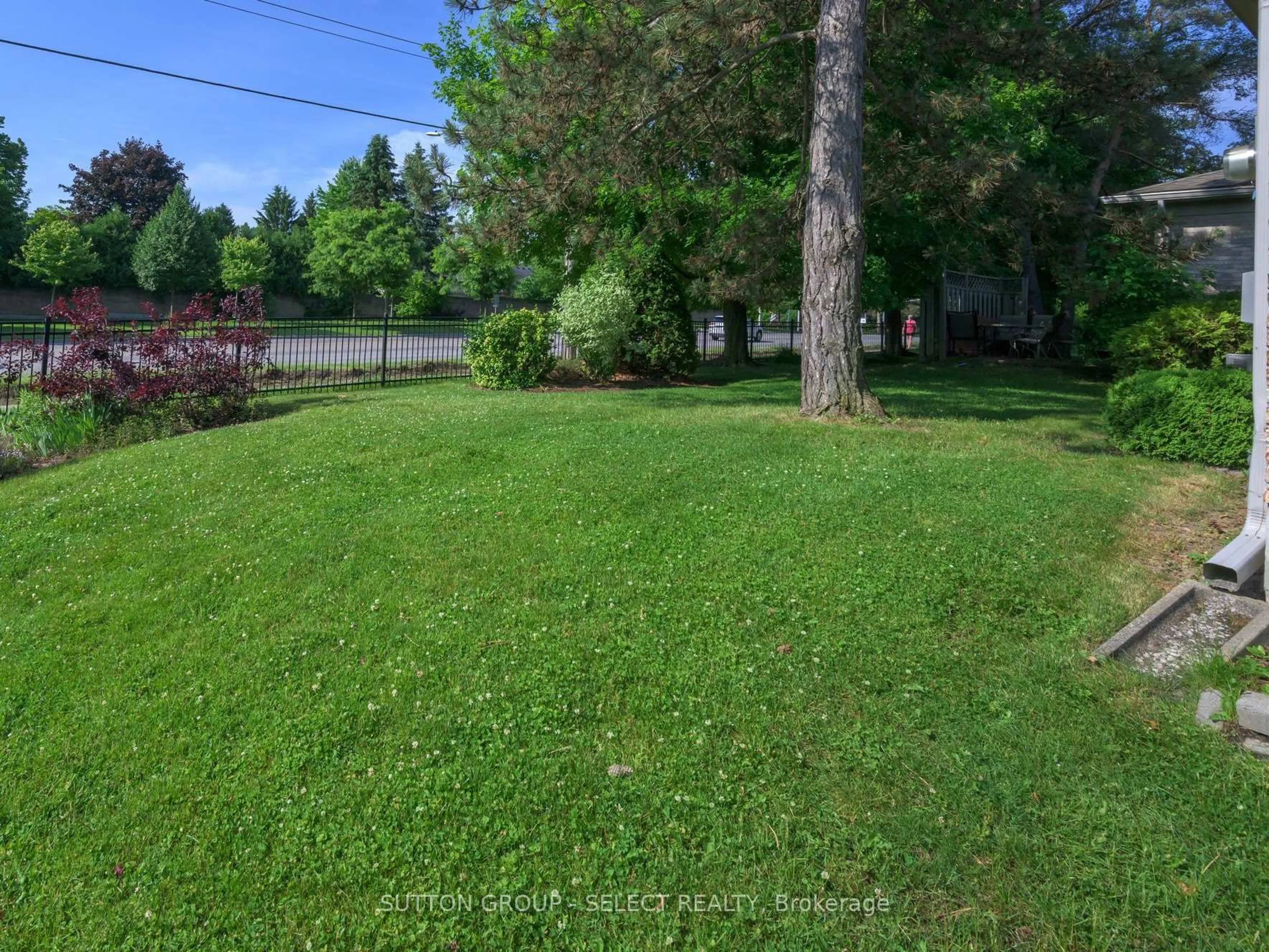 A pic from outside/outdoor area/front of a property/back of a property/a pic from drone, forest/trees view for 14 Doon Dr #7, London North Ontario N5X 3P2