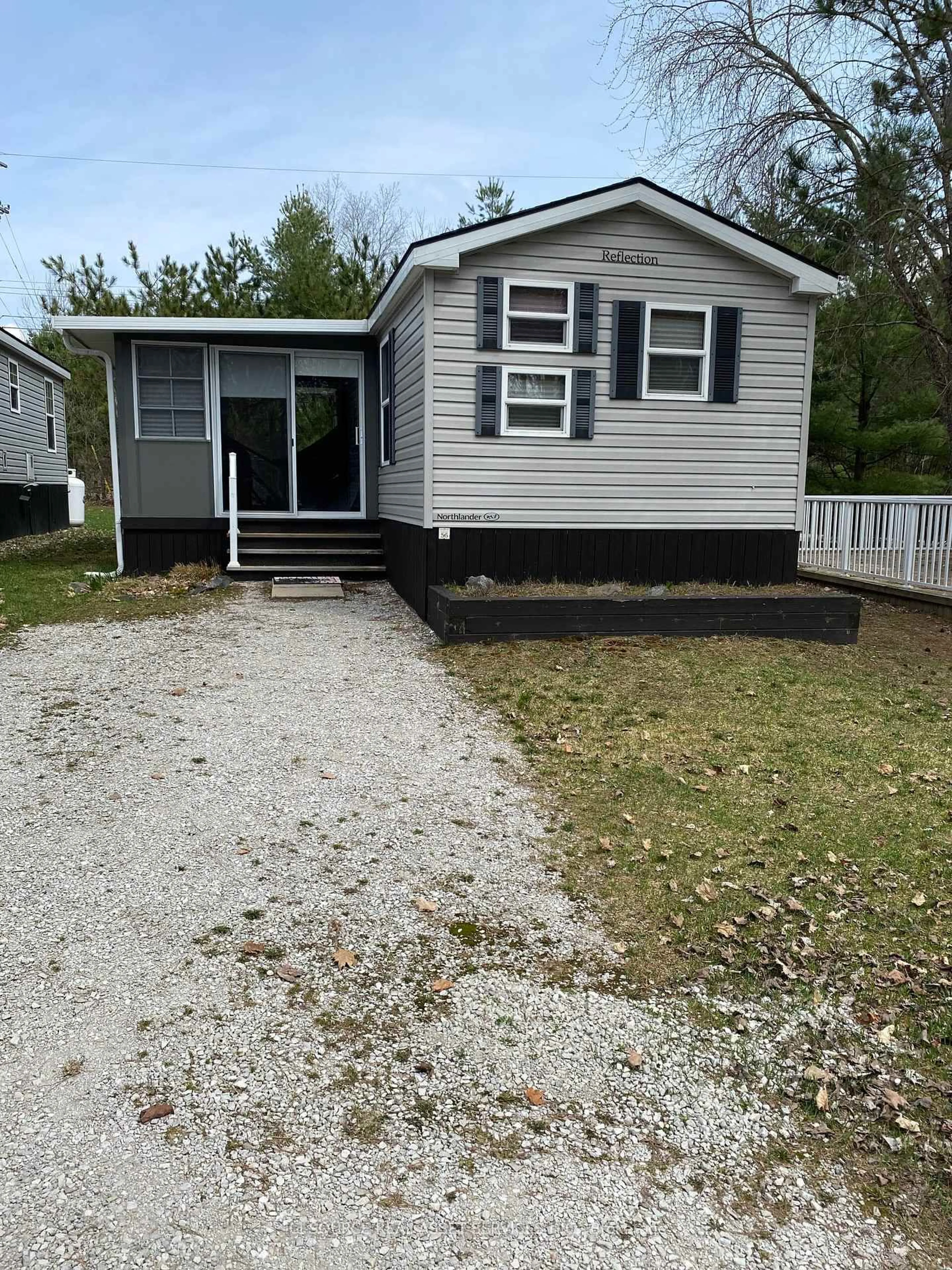 Home with vinyl exterior material, street for 1082 Shamrock Marina Rd #SMR056, Gravenhurst Ontario P0E 1N0