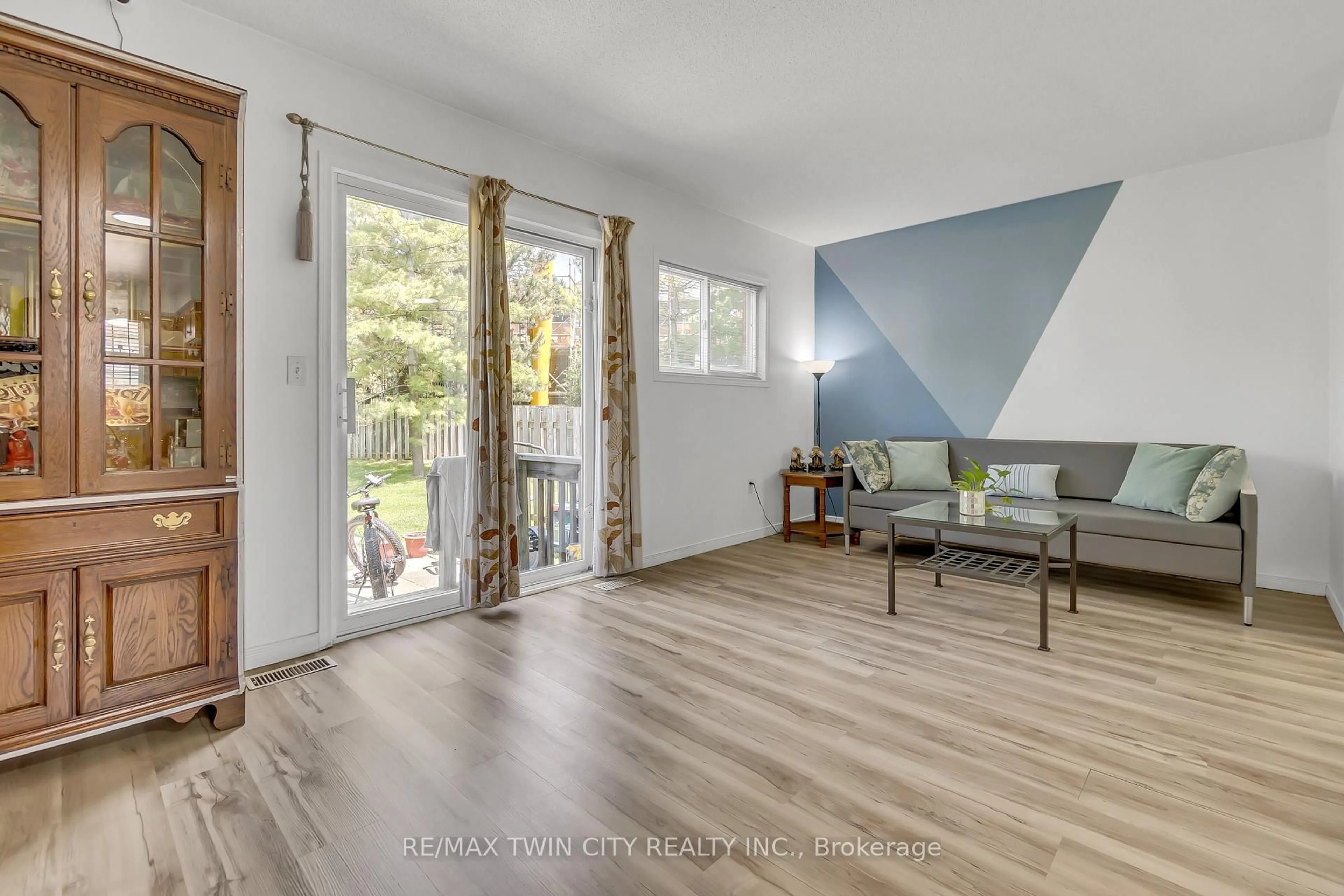 Living room with furniture, wood/laminate floor for 400 Wilson Ave #31, Kitchener Ontario N2C 2S1