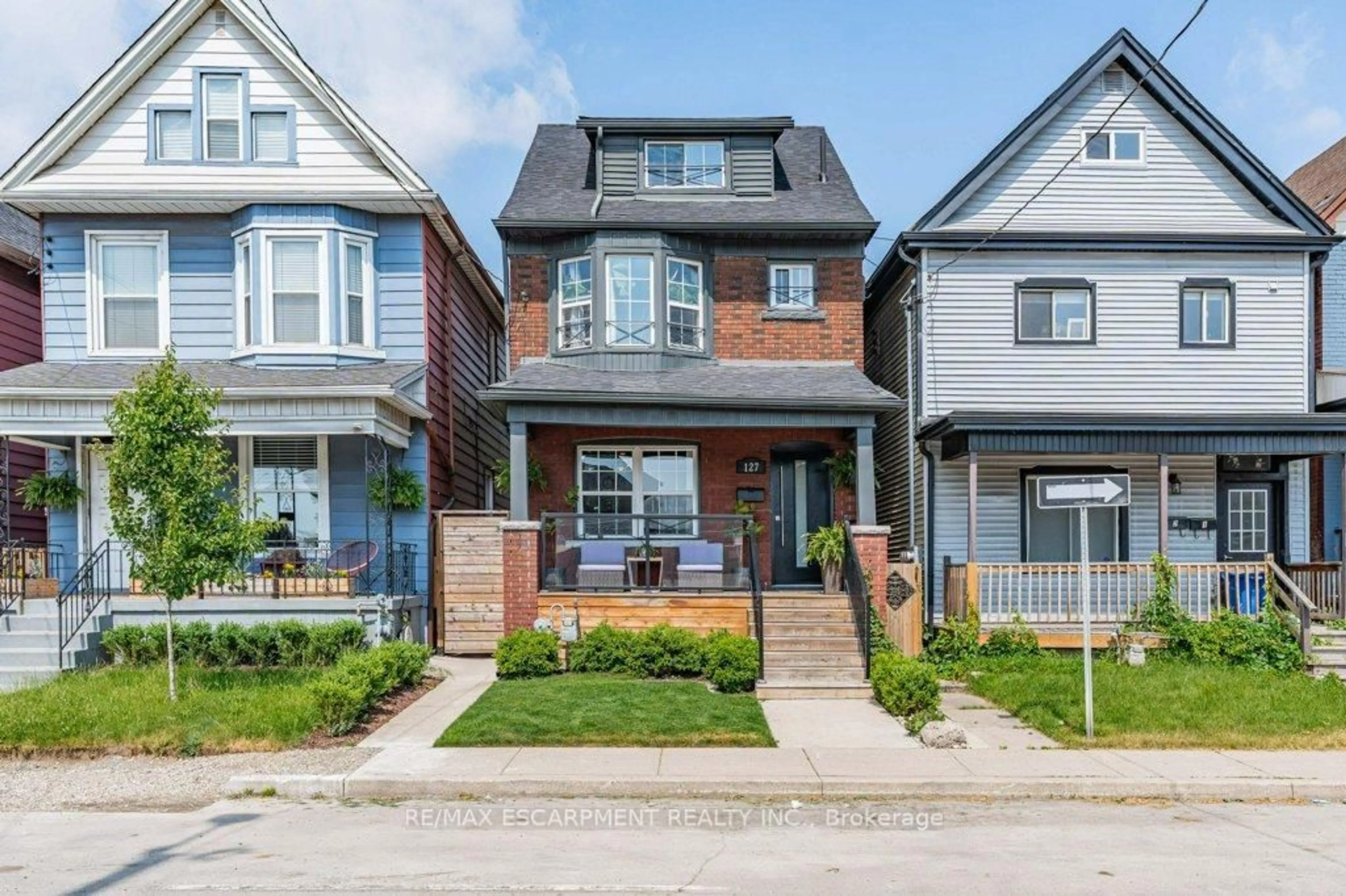 Home with brick exterior material, street for 127 Sherman Ave, Hamilton Ontario L8L 6M3