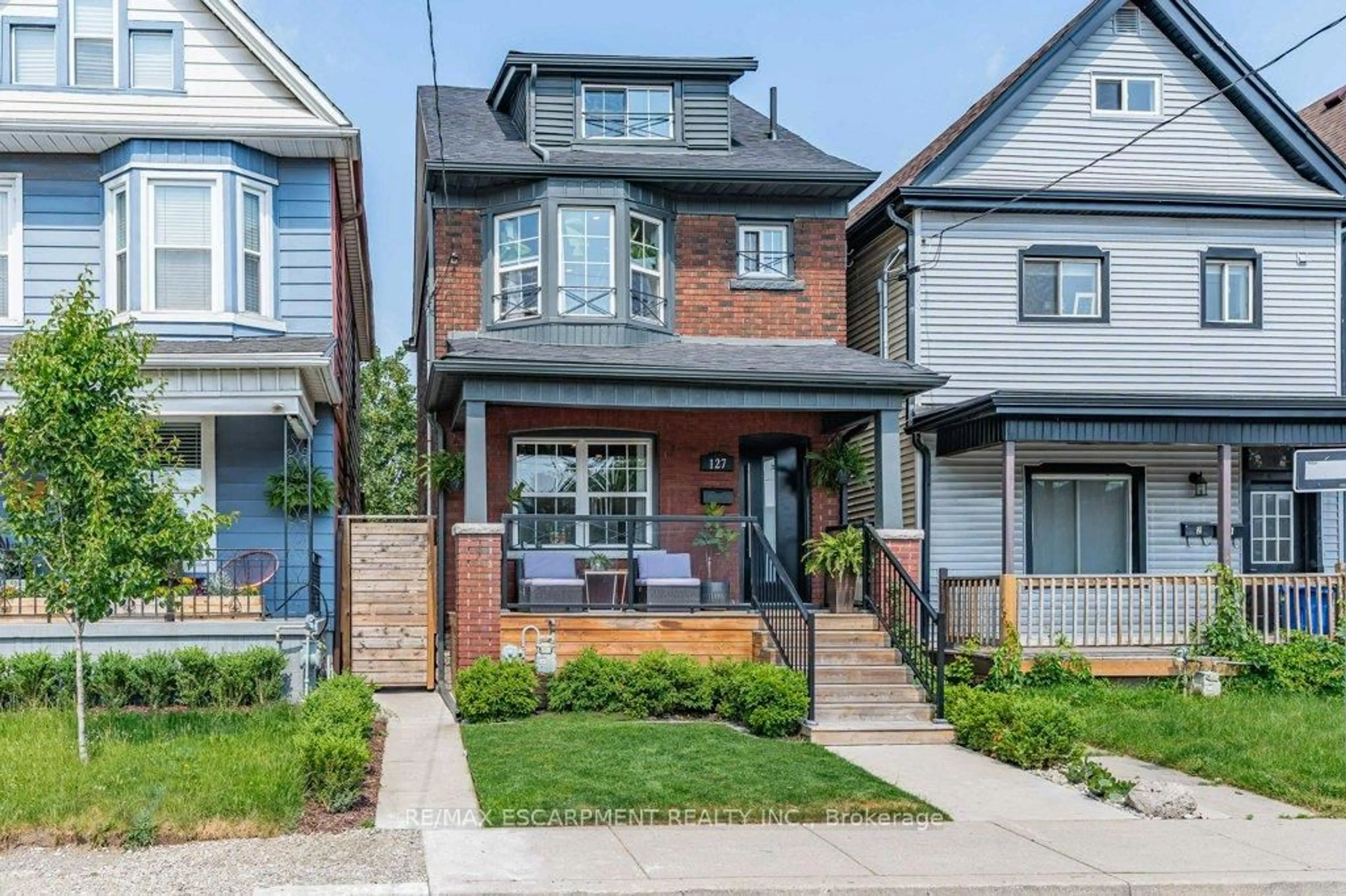 Home with brick exterior material, street for 127 Sherman Ave, Hamilton Ontario L8L 6M3