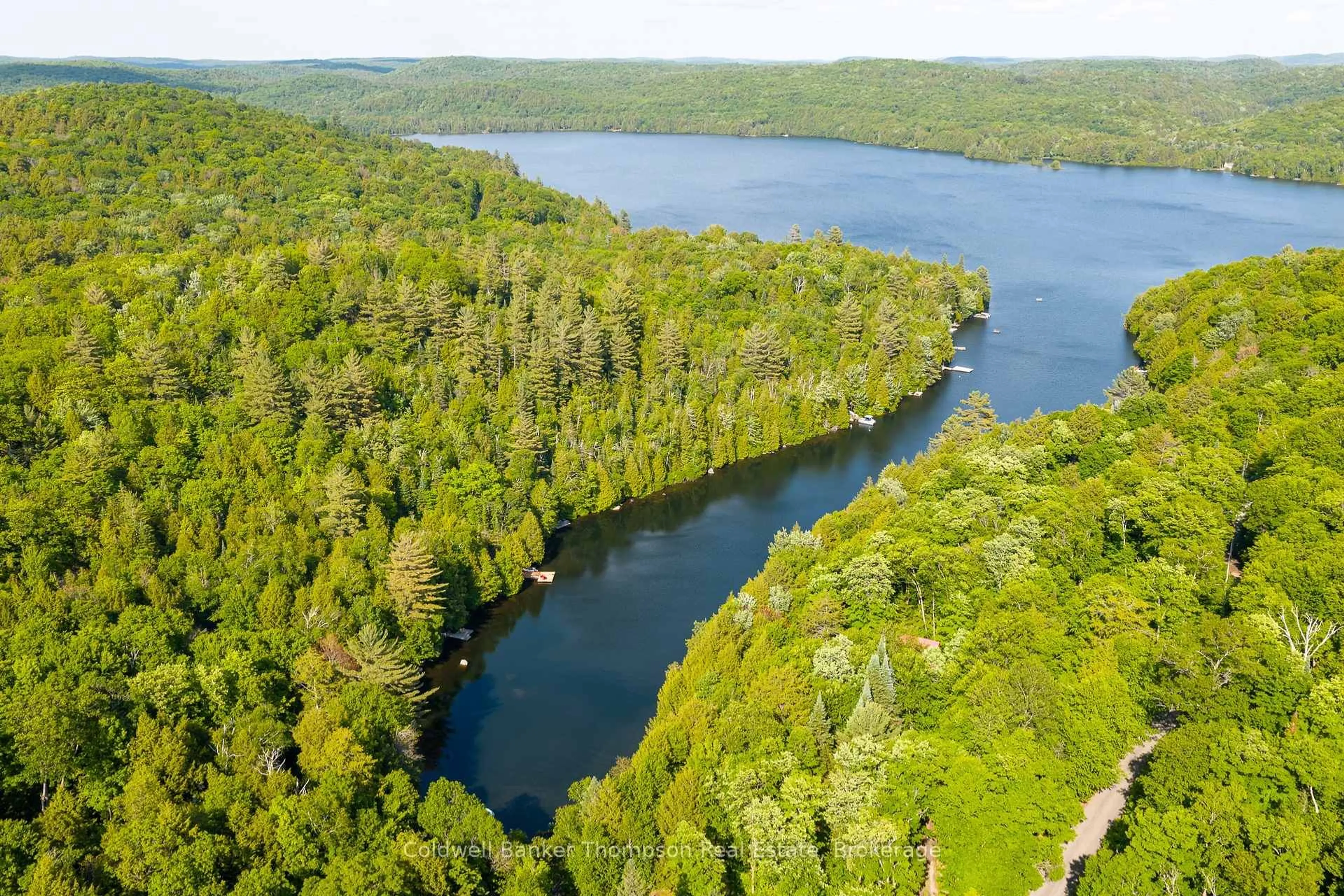A pic from outside/outdoor area/front of a property/back of a property/a pic from drone, water/lake/river/ocean view for 91B Cedar Lane, Kearney Ontario P0A 1M0