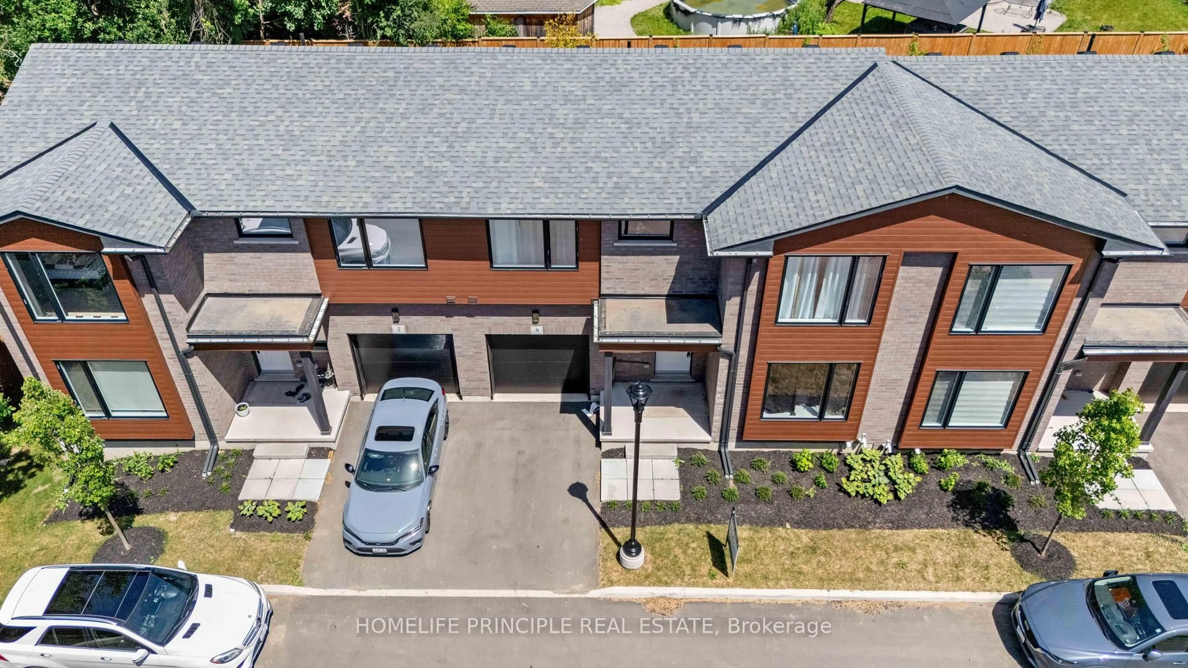 A pic from outside/outdoor area/front of a property/back of a property/a pic from drone, street for 264 Blair Rd #8, Cambridge Ontario N1S 4K9