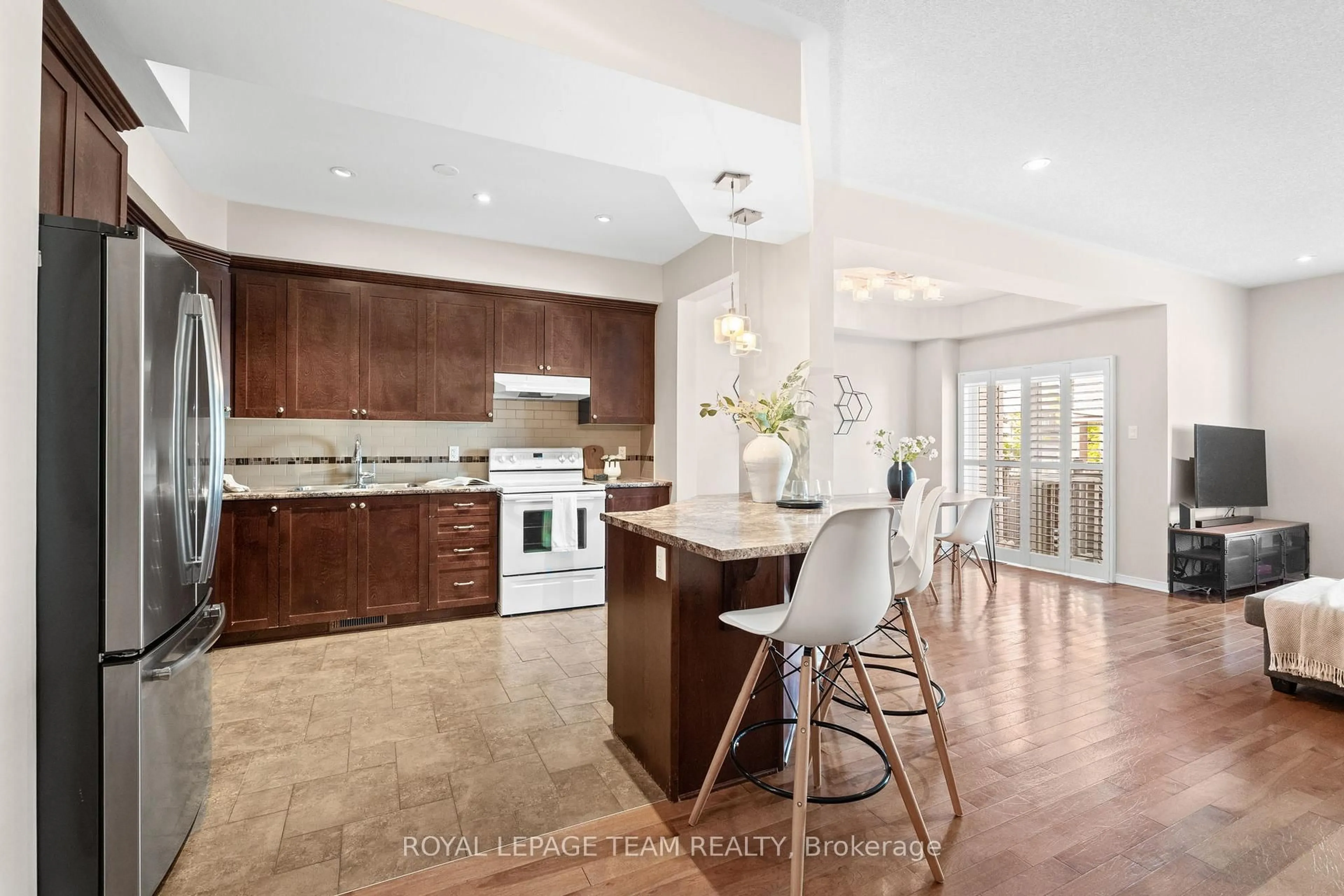 Open concept kitchen, ceramic/tile floor for 915 Torovin Private, Ottawa Ontario K1B 0A4