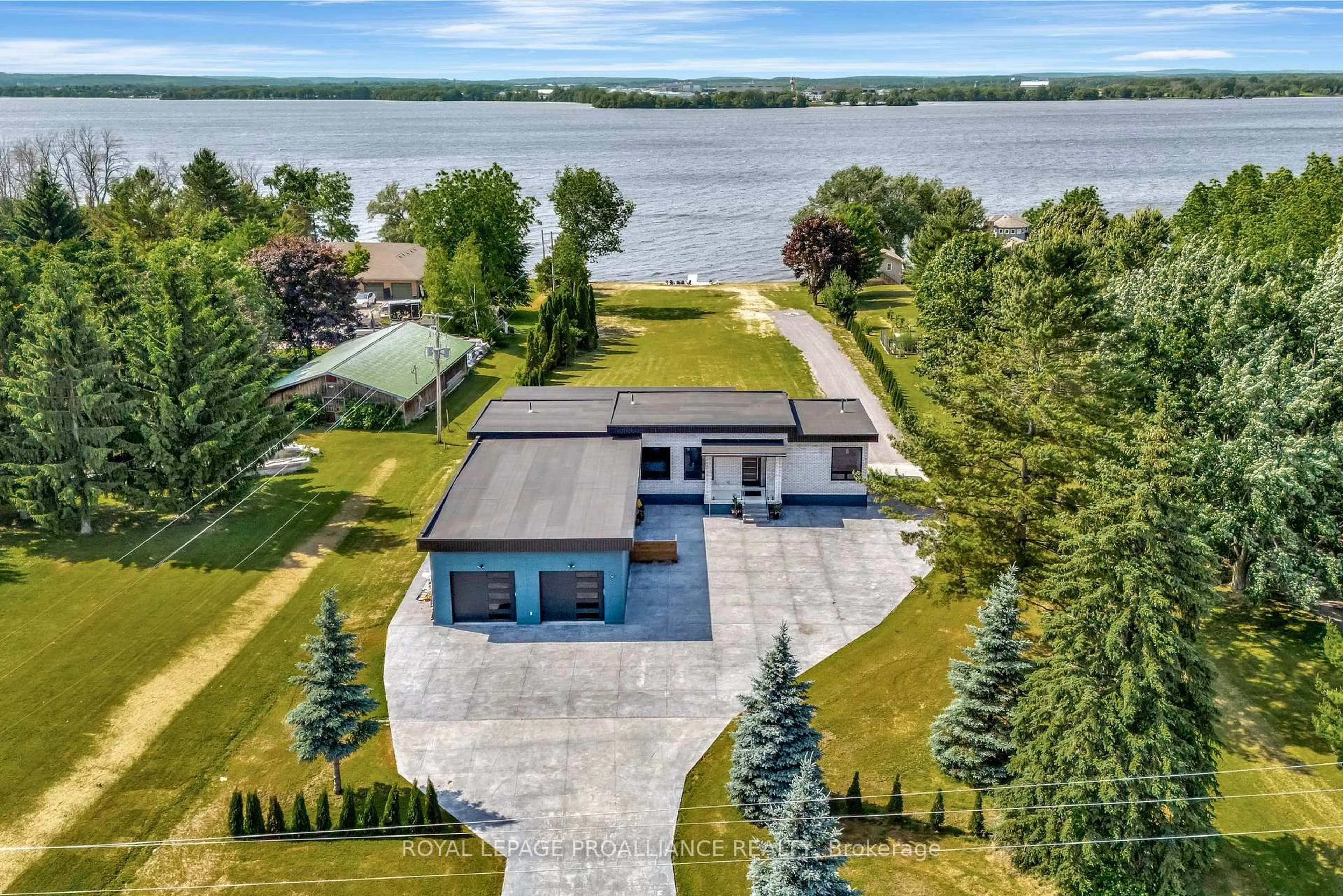 A pic from outside/outdoor area/front of a property/back of a property/a pic from drone, water/lake/river/ocean view for 2528 County Rd 3, Prince Edward County Ontario K0K 1L0