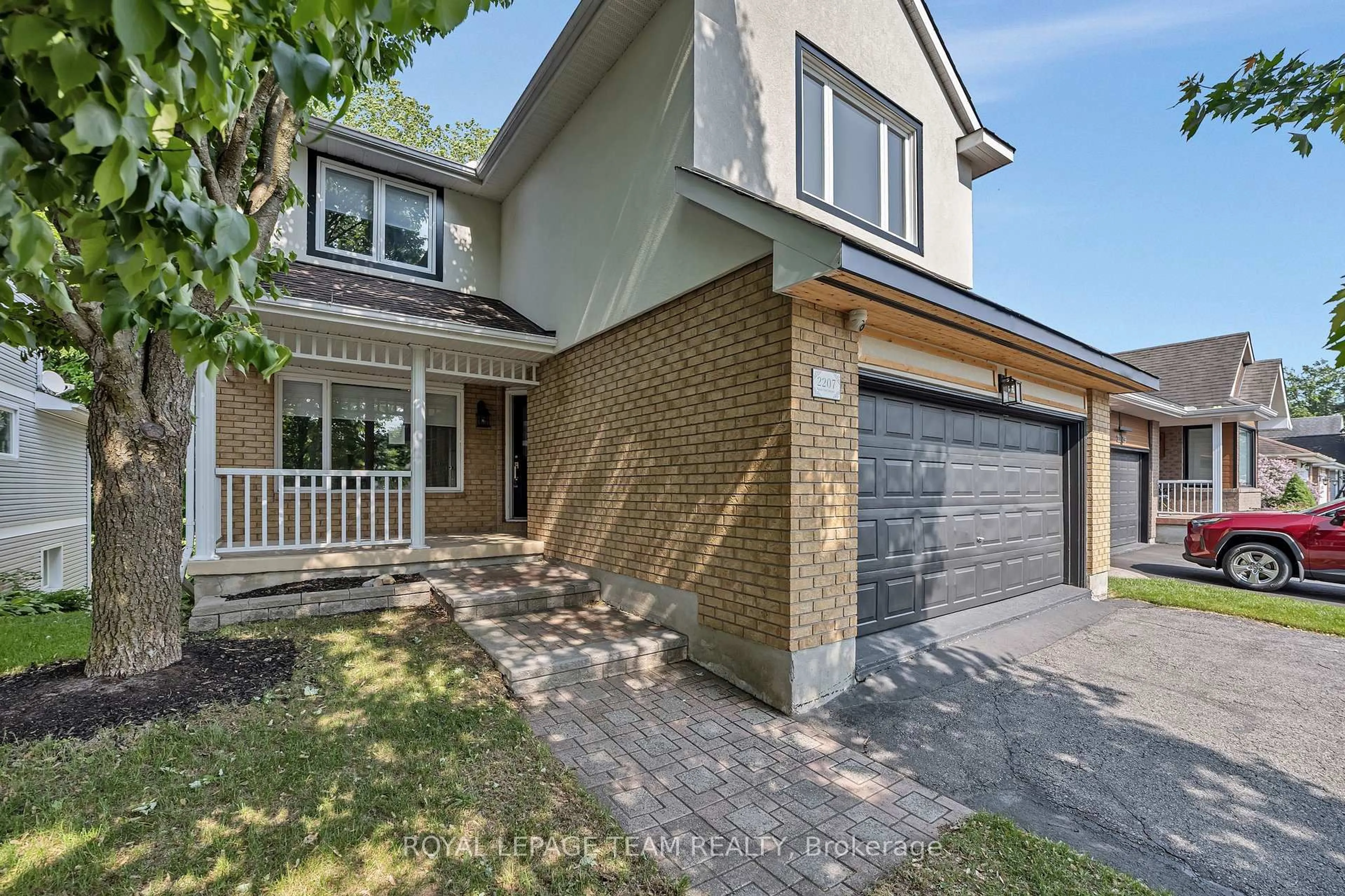 Home with brick exterior material, street for 2207 Nature Trail Cres, Ottawa Ontario K1W 1E7