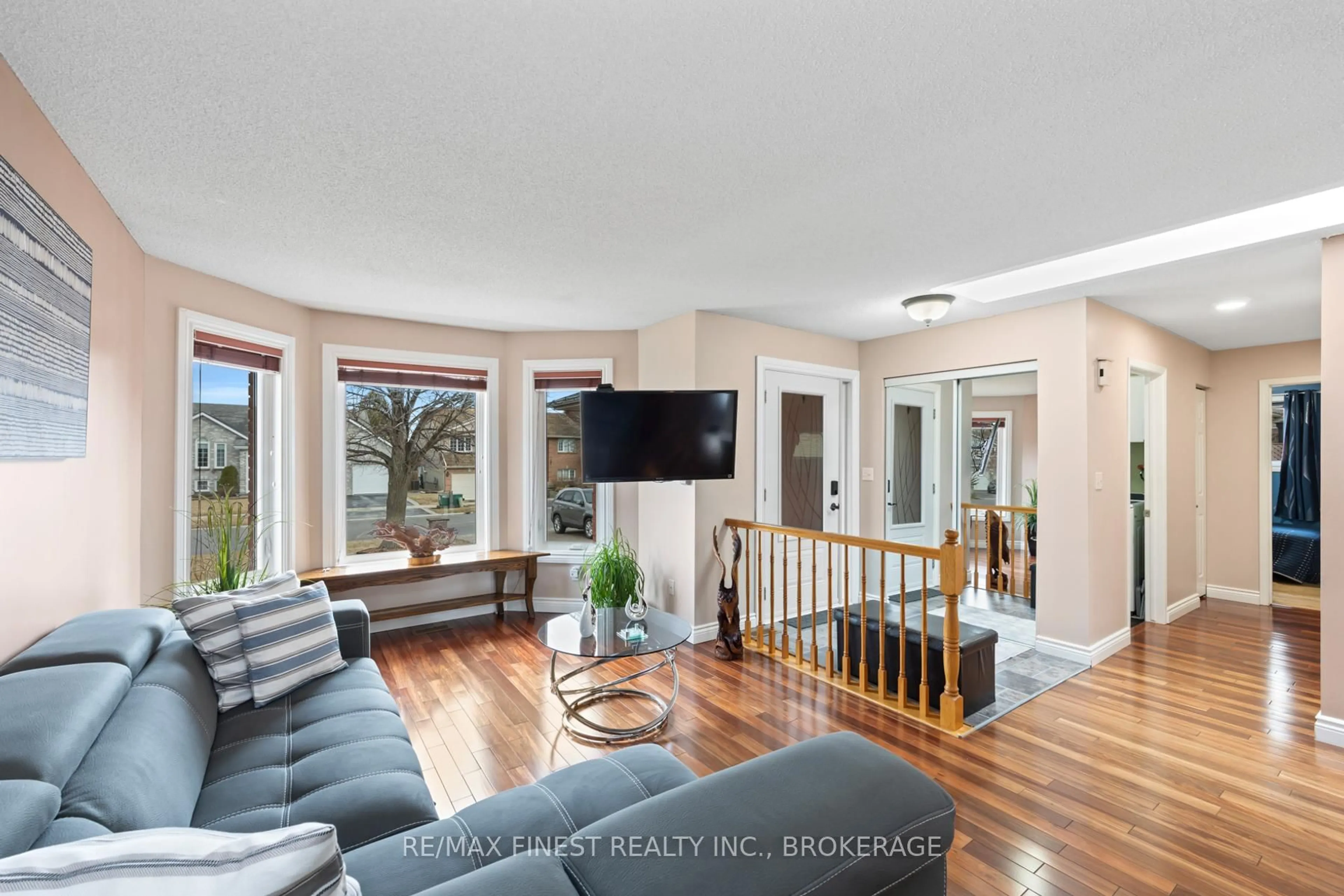 Living room with furniture, wood/laminate floor for 525 Citation Cres, Kingston Ontario K7M 8W2