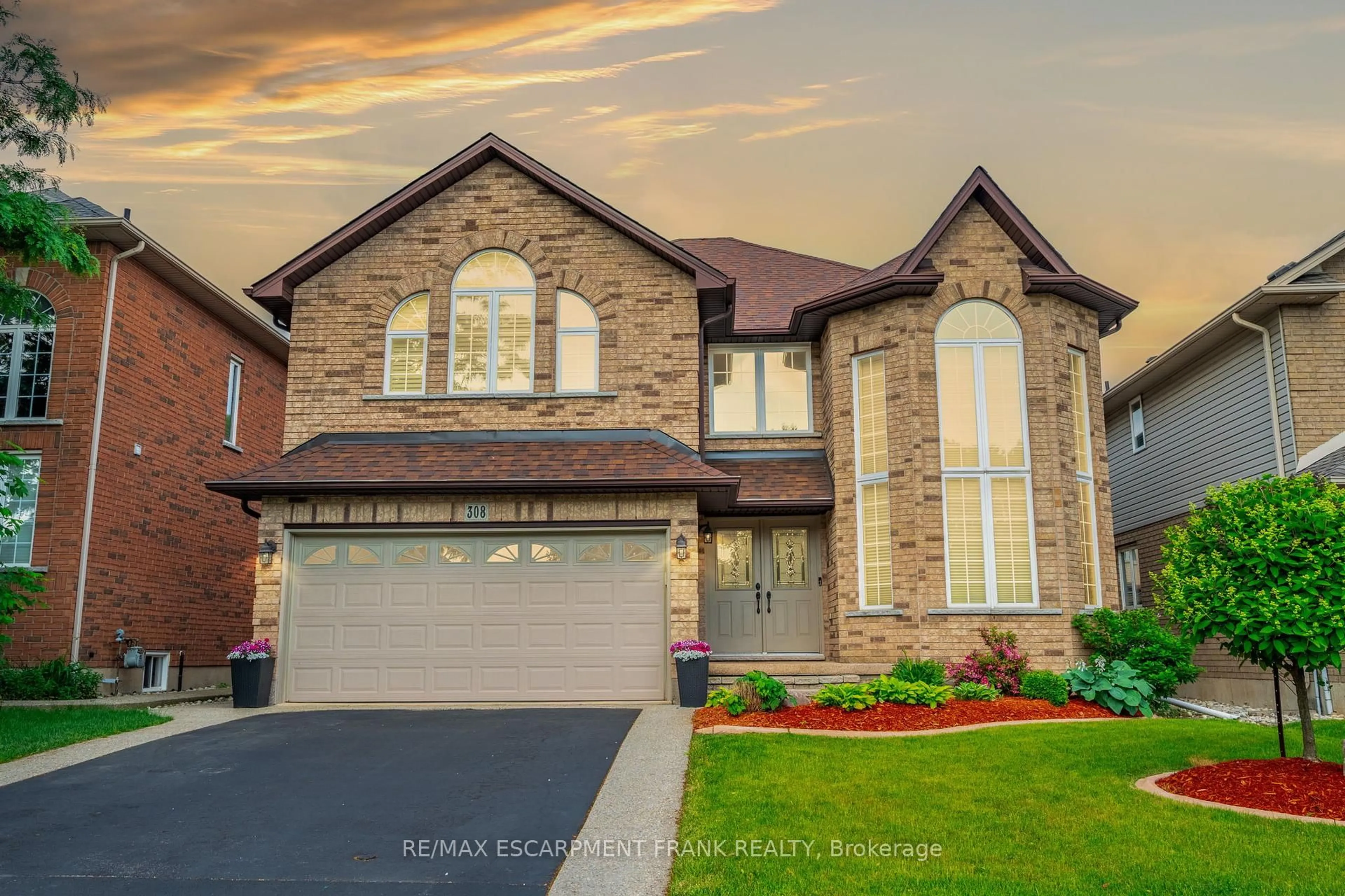 Home with brick exterior material, street for 308 KITTY MURRAY Lane, Hamilton Ontario L9K 1N6