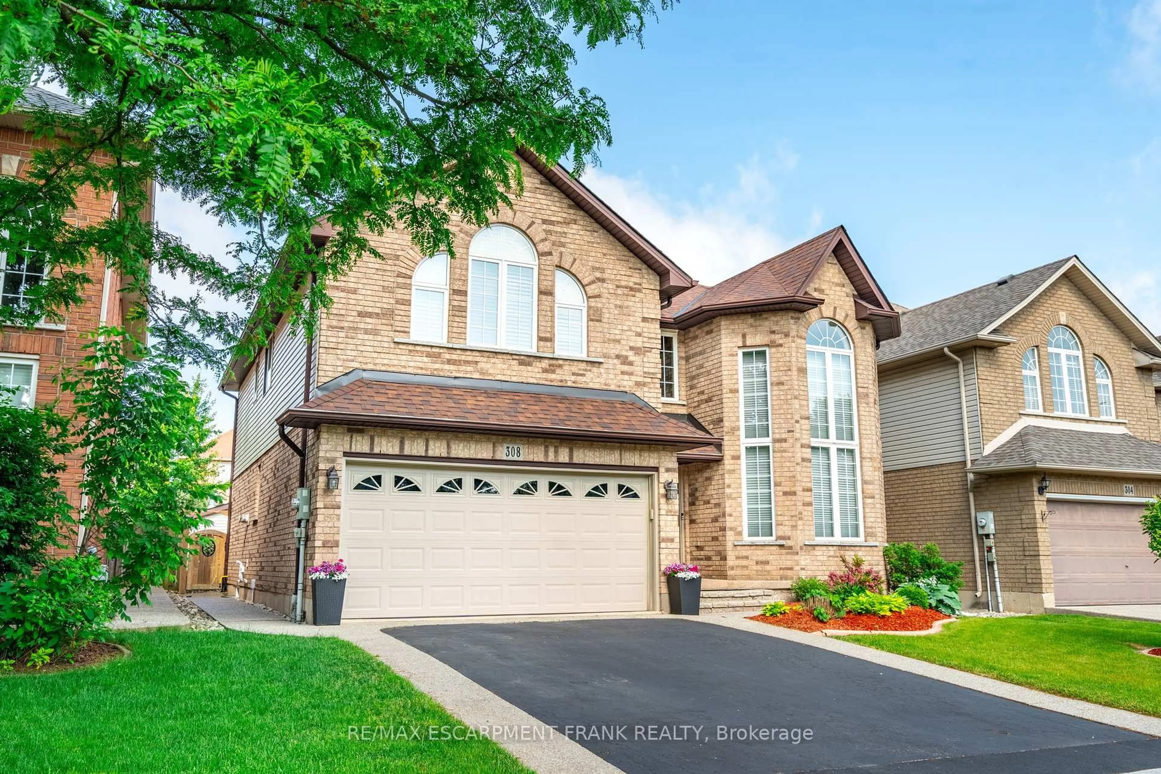 Home with brick exterior material, street for 308 KITTY MURRAY Lane, Hamilton Ontario L9K 1N6